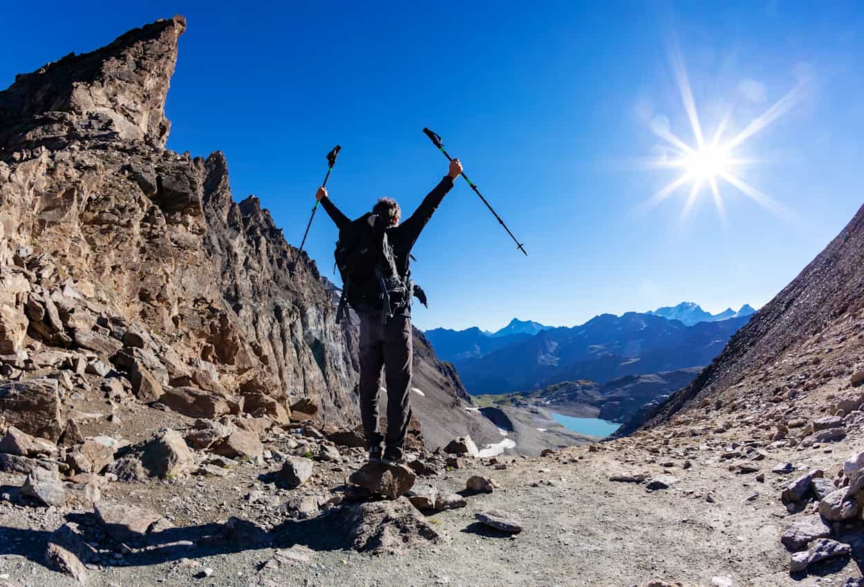 Hiker at the top of Col Bassac, Italian Alps, Val D'Aosta, Italy, Gran Paradiso National Park.