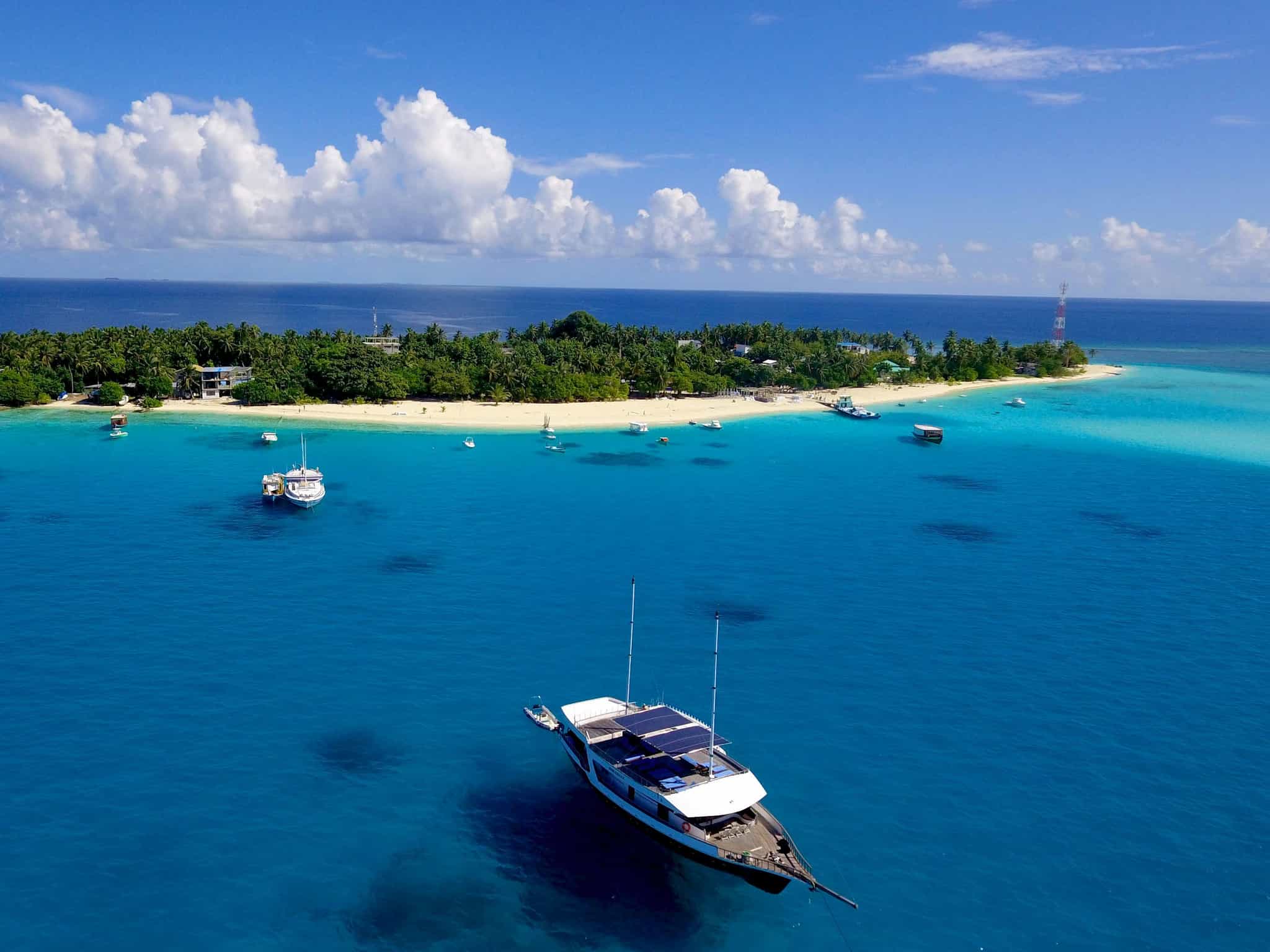 Aerial view of boats in the sea around Fulidhoo island, Maldives
