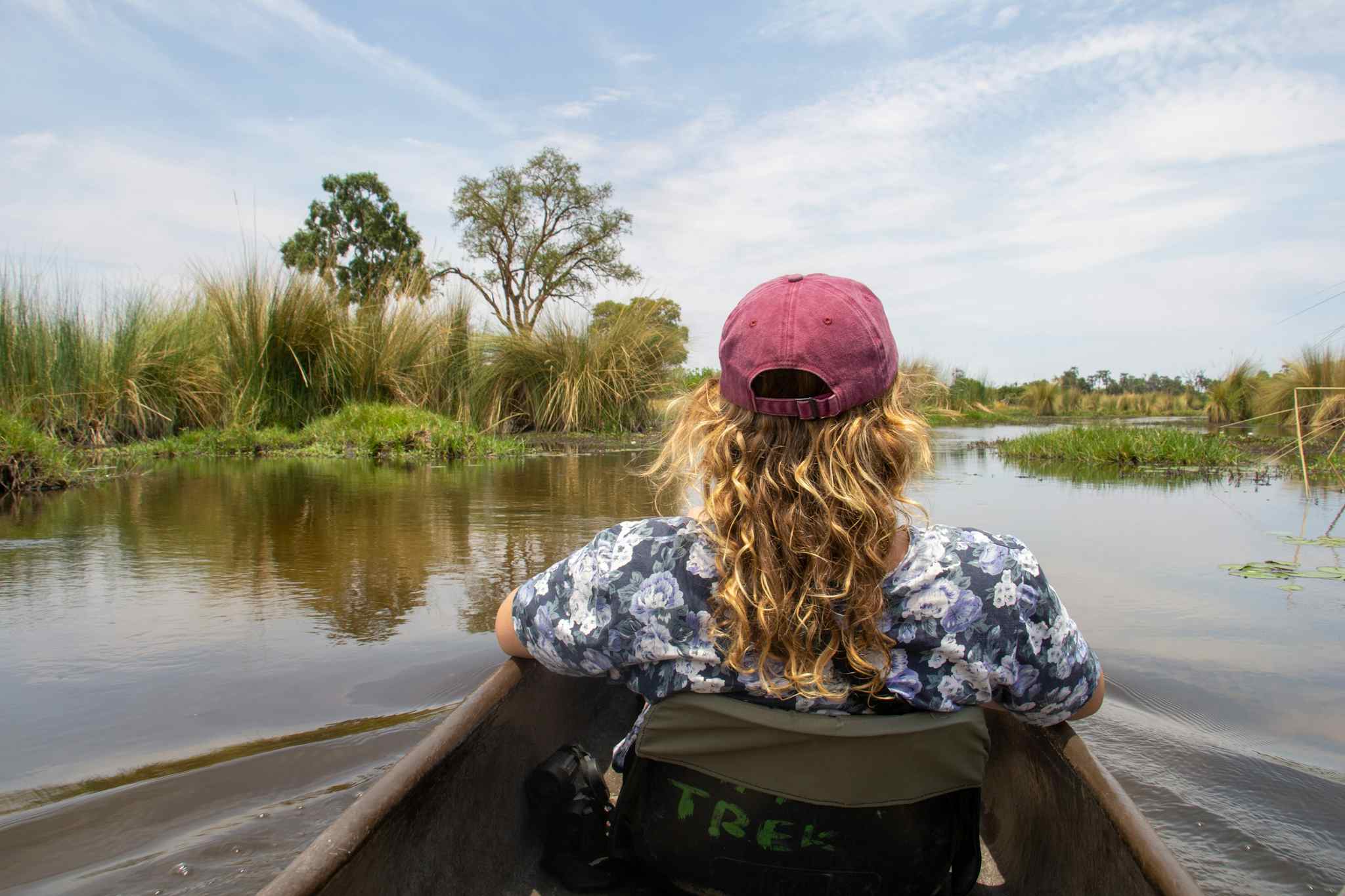 STAFF - Girl on a mokoro joruney in the Okavango Delta, Botswana Photo: Customer/Chris Kearney
