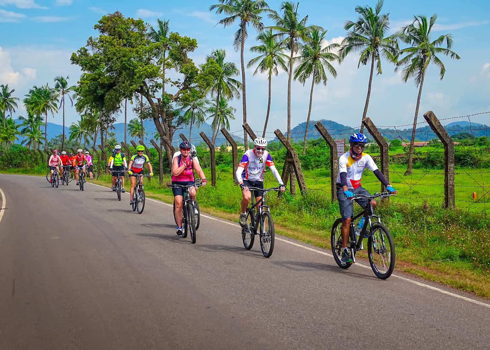 Group of cyclists on the backroads of Kerala, India