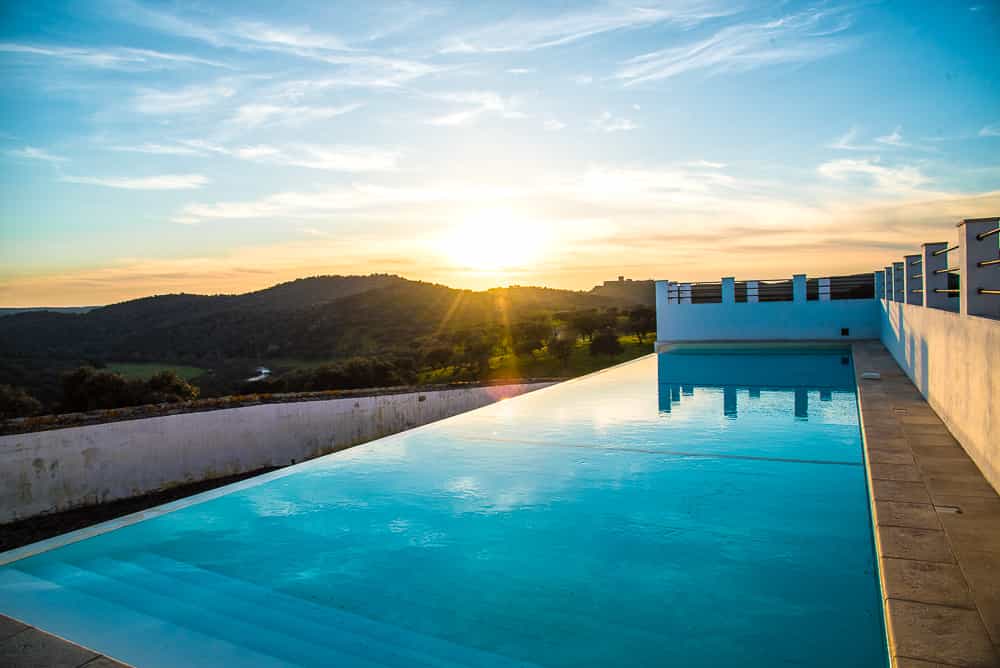 Herdade da Coitadinha hotel in Noudar overlooking the pool.