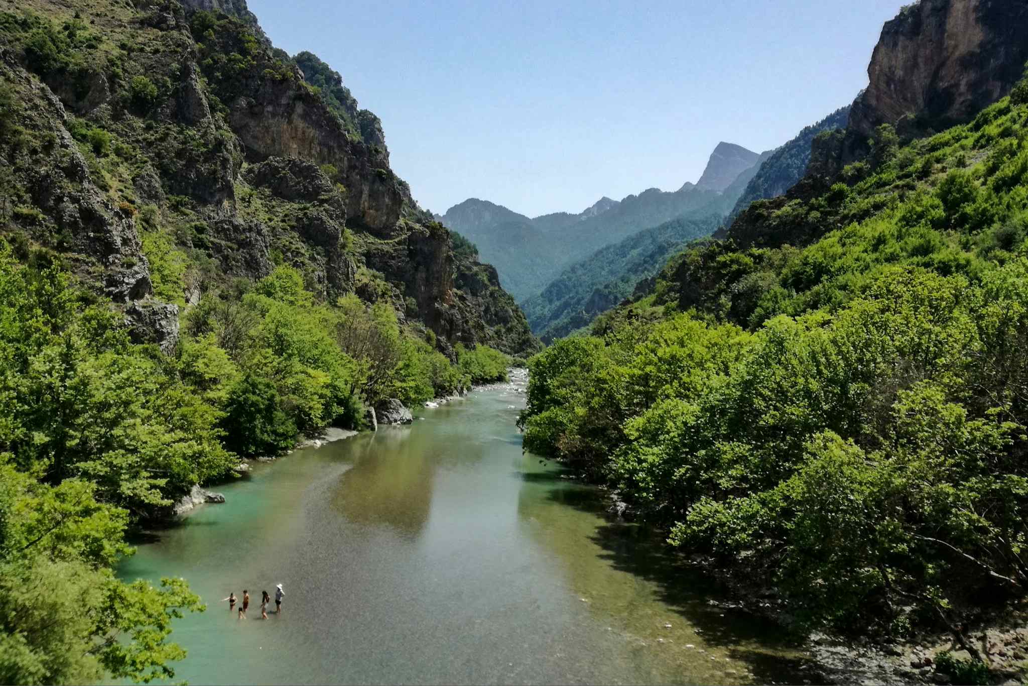 HOST - People swimming in the Aoos River in Northern Greece. Photo: Host/Nomads Path
