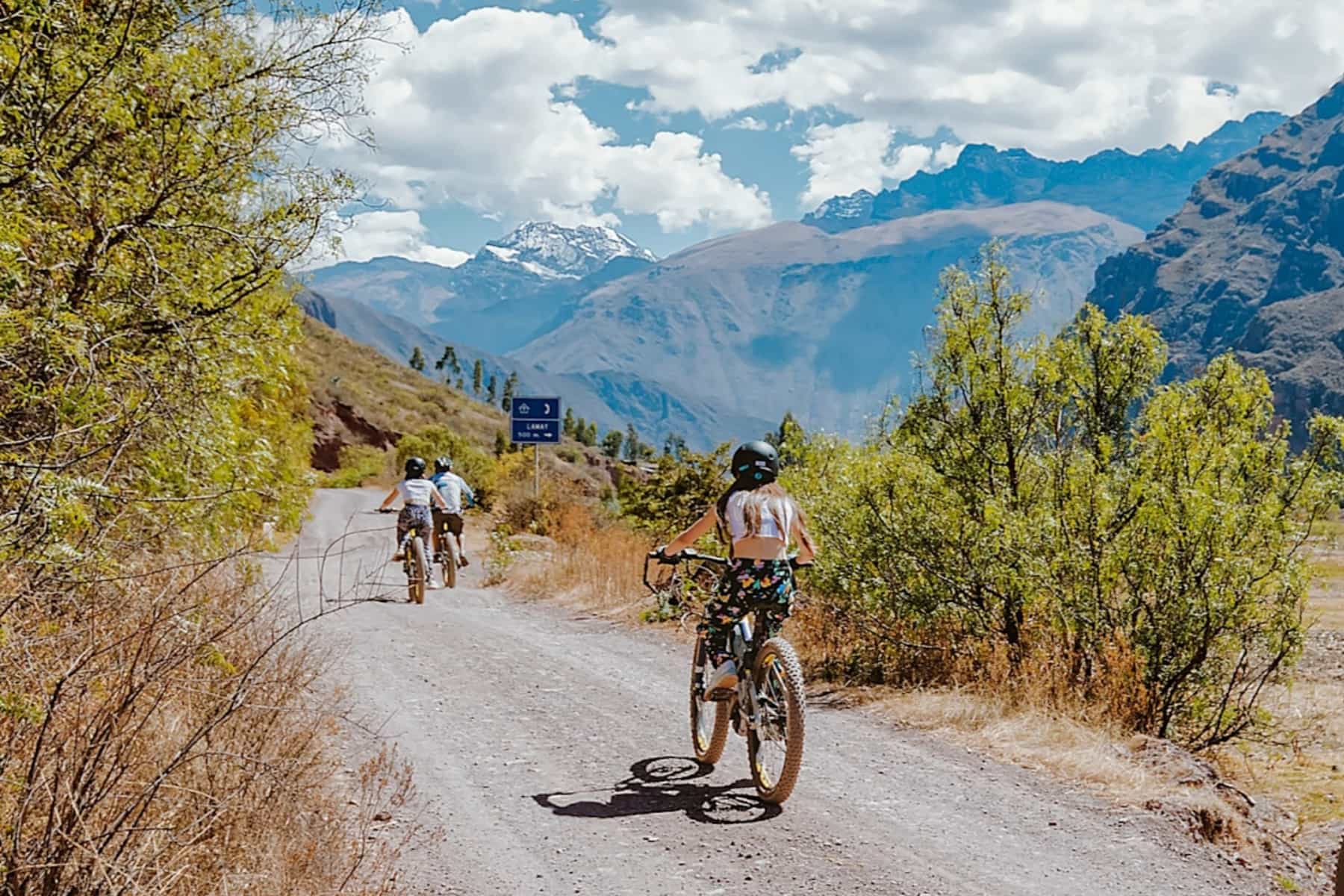 Cyclist pedalling on a gravel track in the Sacred Valley, Peru
