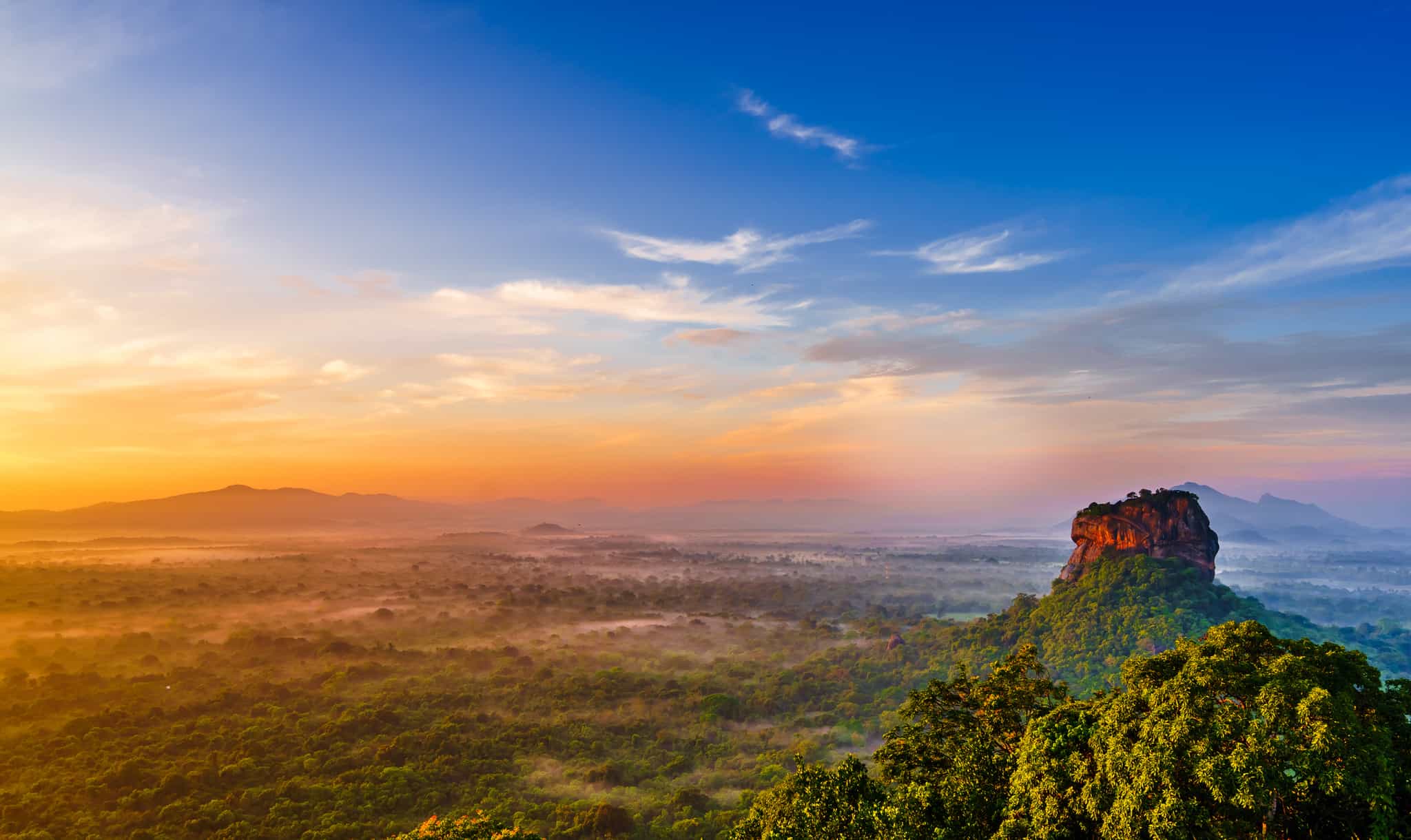 Sunrise view to Sigiriya (Lion Rock) from Pidurangala Rock in Sri Lanka.
