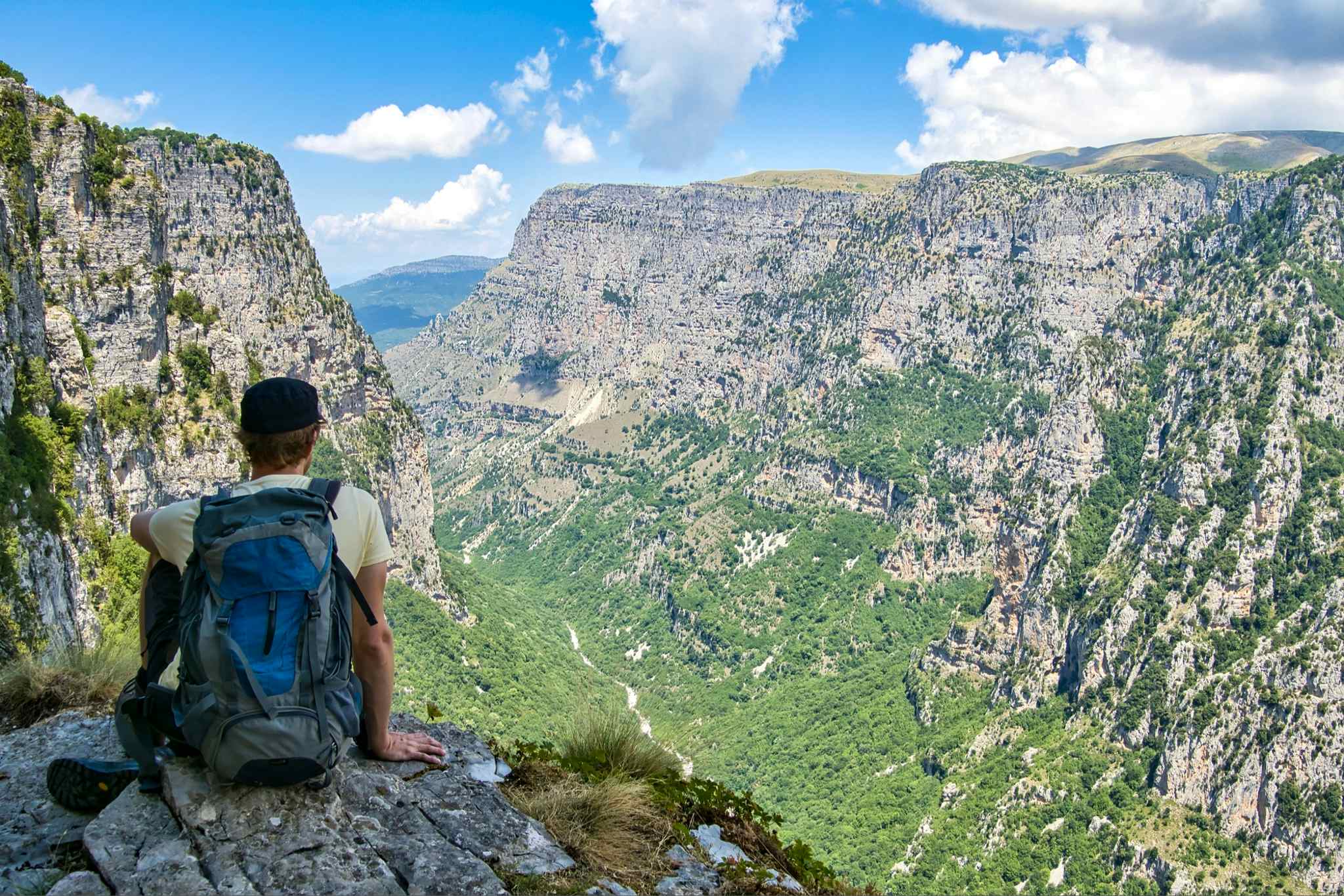 GETTY - Man at a lookout point overlooking Vikos Gorge, Greece. Photo: Getty # 1342702719
