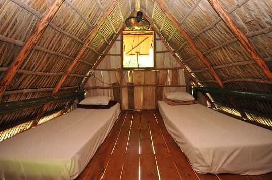 Beds inside the stilted hut at Complejo Las Terrazas, Cuba