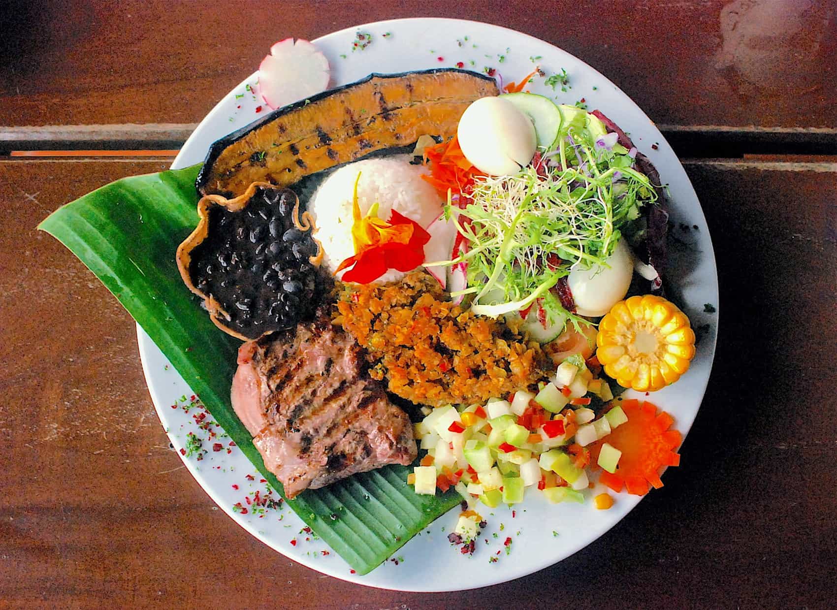 Typical Costa Rican dish of Casados – a mixture of refried beans, vegetables and rice with tortilla