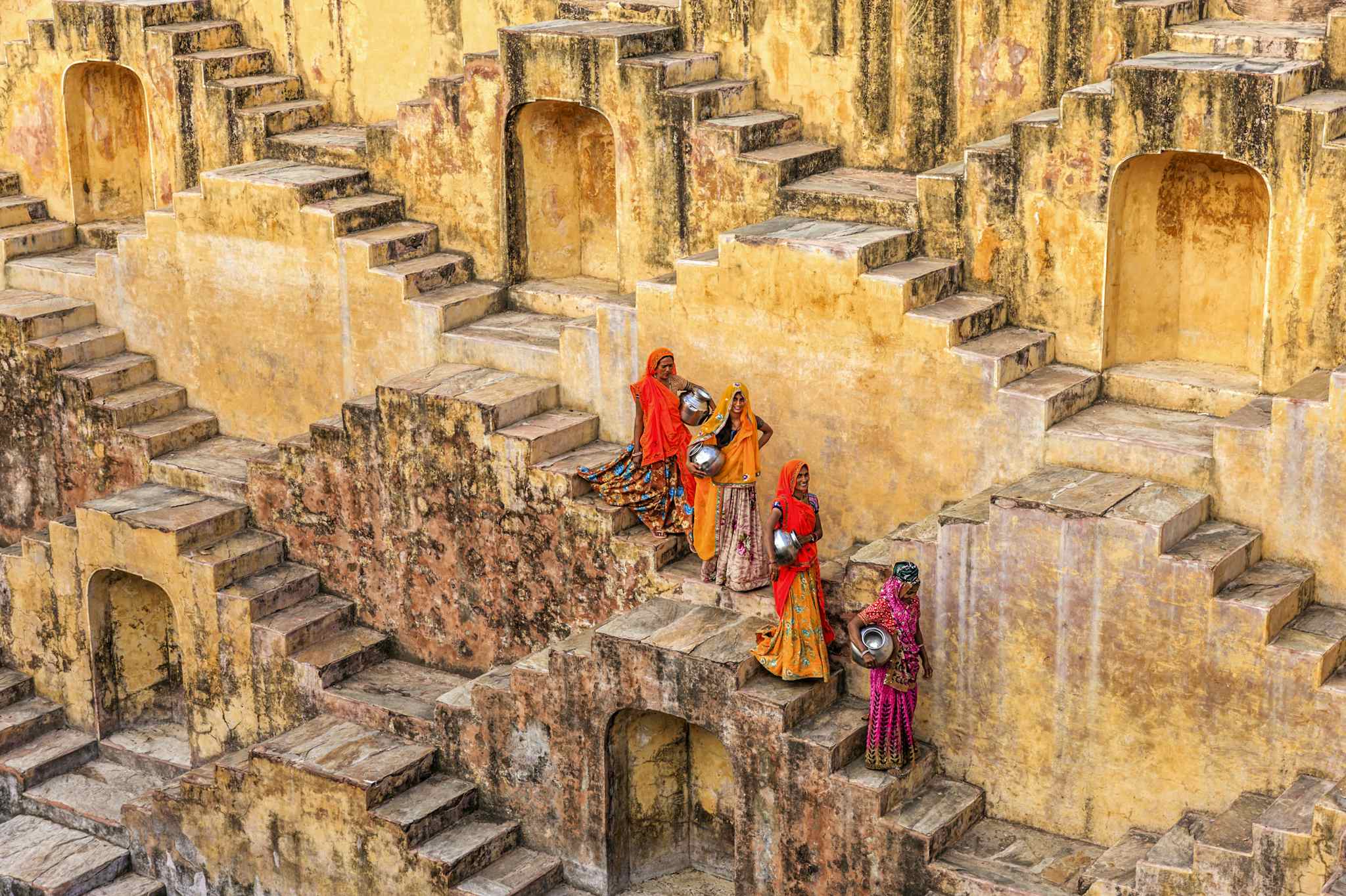 Indian women carrying water from stepwell near Jaipur. Photo: Getty #493063982