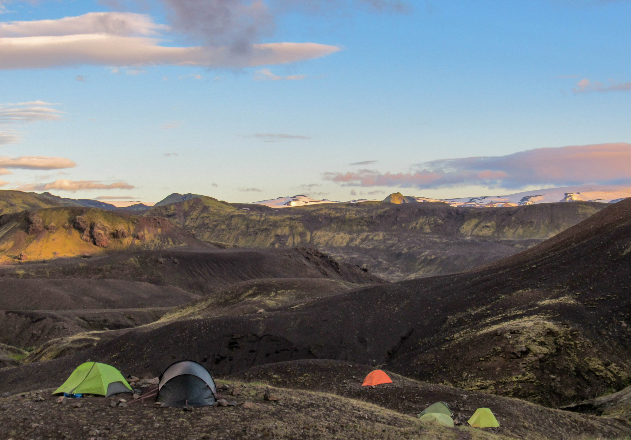 Laugavegur Trail Camping, Iceland. Photo: Canva - https://www.canva.com/photos/MADLGtWyuiI-sunset-landscape-with-campsite-of-botnar-ermstur-laugavegur-trail-from-thorsmork-to-landmannalaugar-iceland/