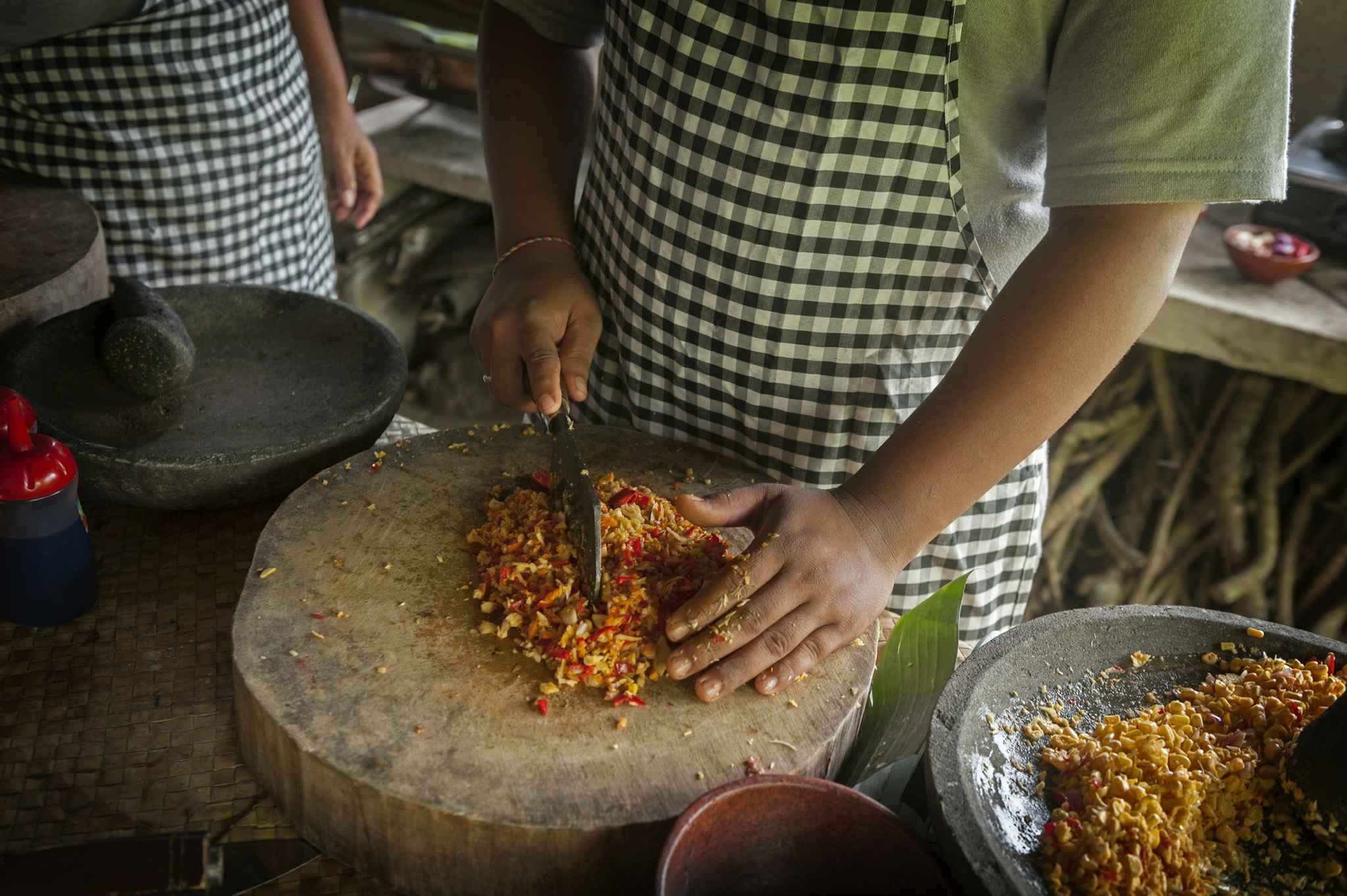 Local chopping vegetables in Bali, Indonesia