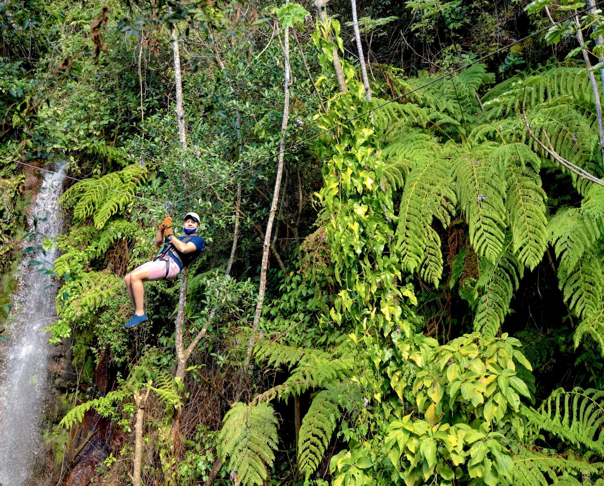 Zip line in Costa Rica against green foliage