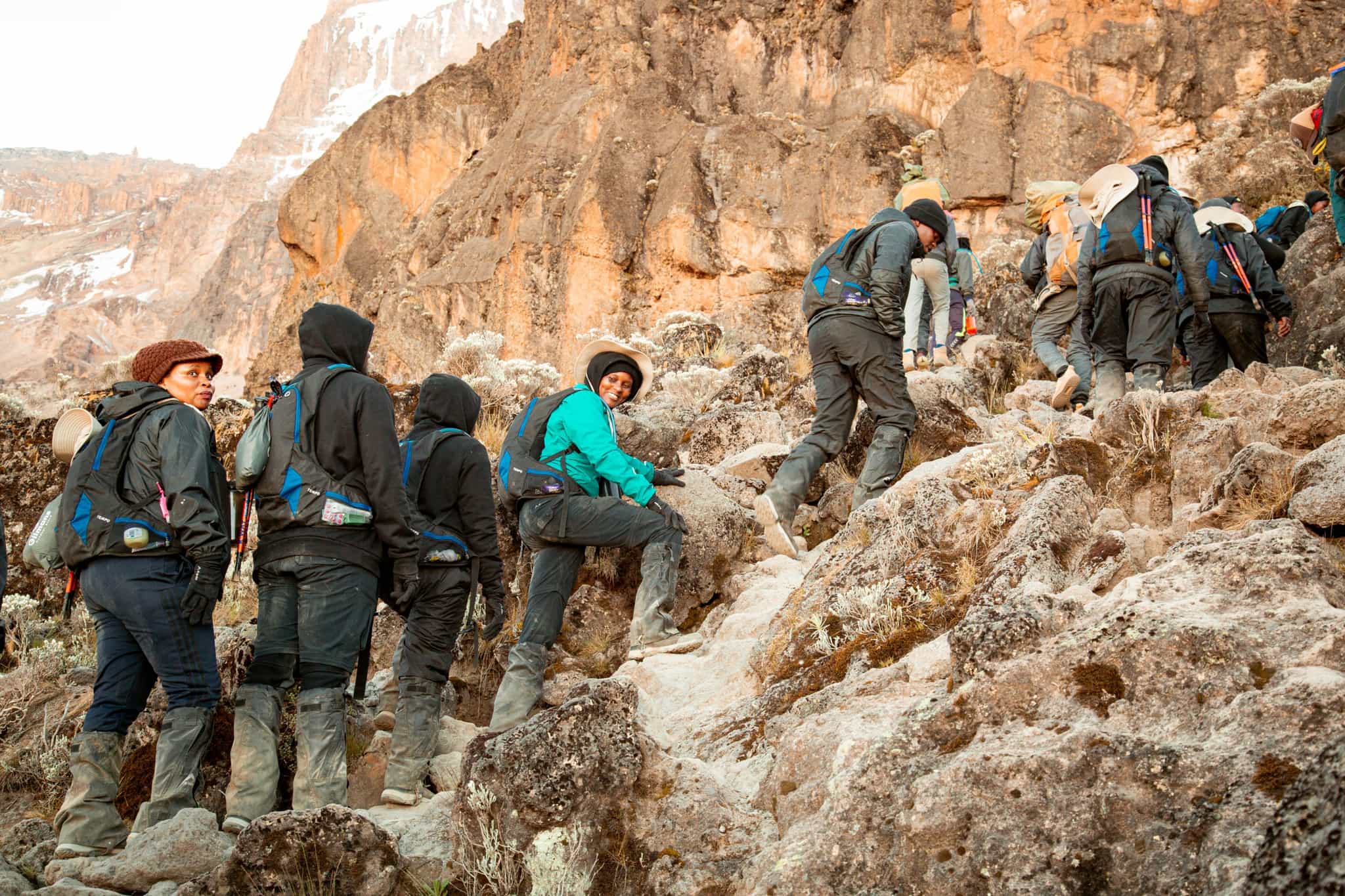 Trekkers climbing up the Barranco Wall on Mount Kilimanjaro, Tanzania.