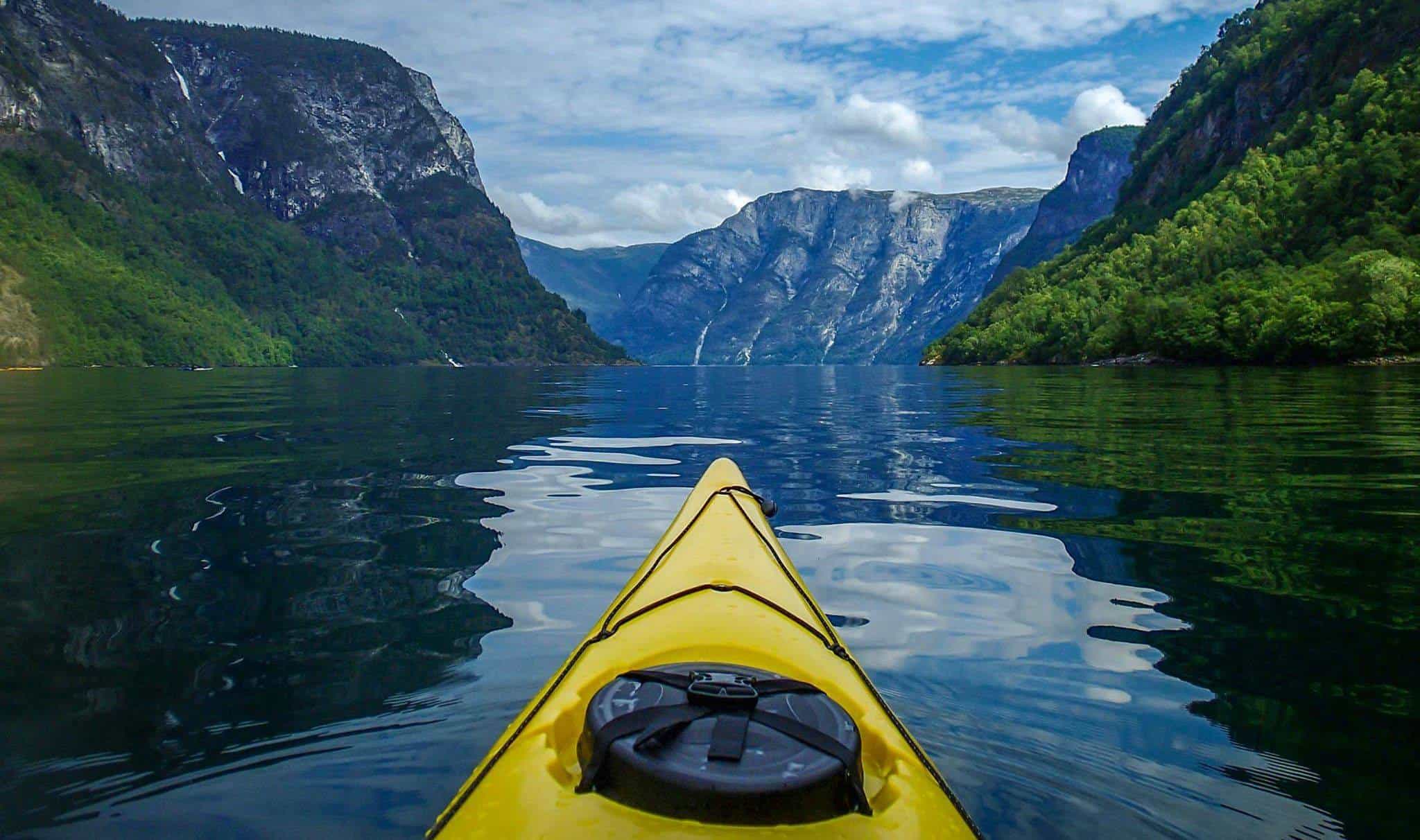 View from a kayak on the waters of the Naeroyfjord in the Norwegian Fjords.