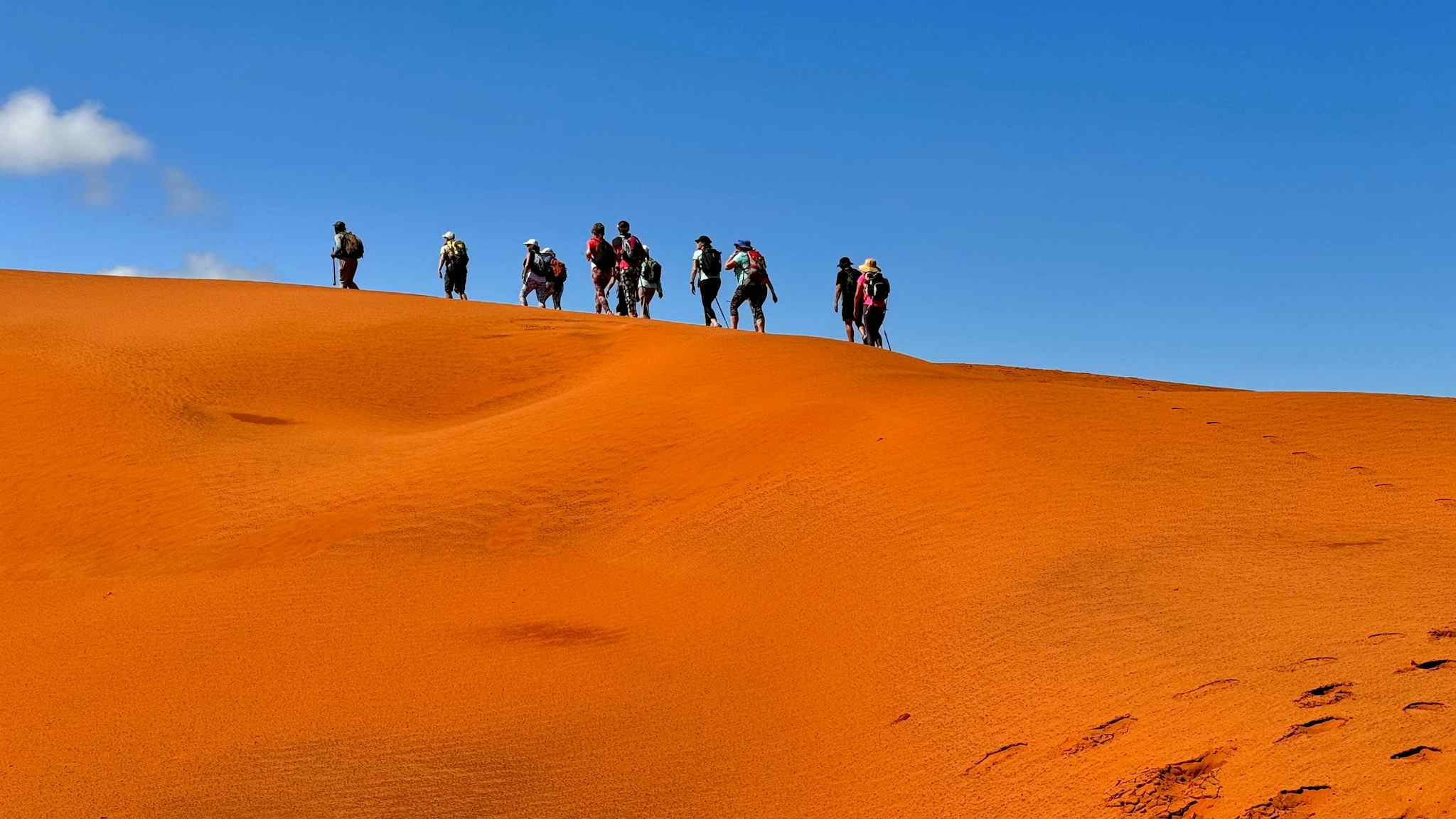 Hikers on the red dunes of Mtentu, South Africa. Photo: Host/Active Escapes