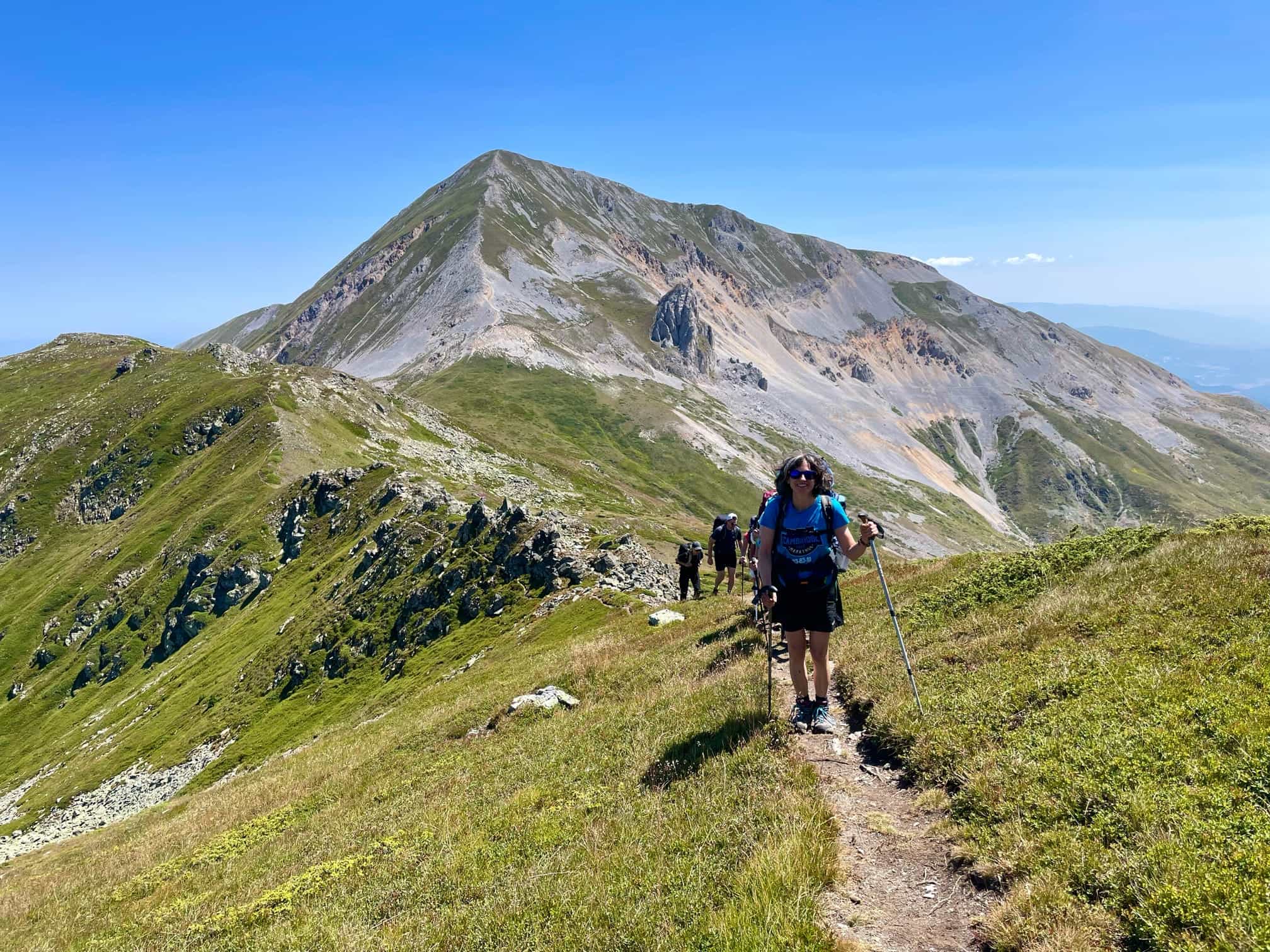 Hikers on a ridgeline trail in the Sharr Mountains.