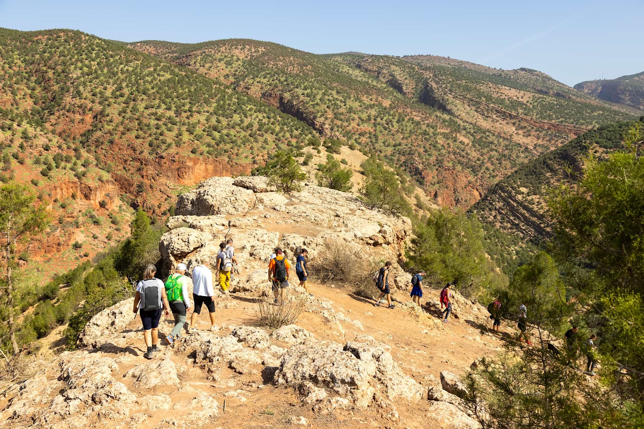 Group of tourists on hiking on trails near Ouzoud town, Atlas, Morocco