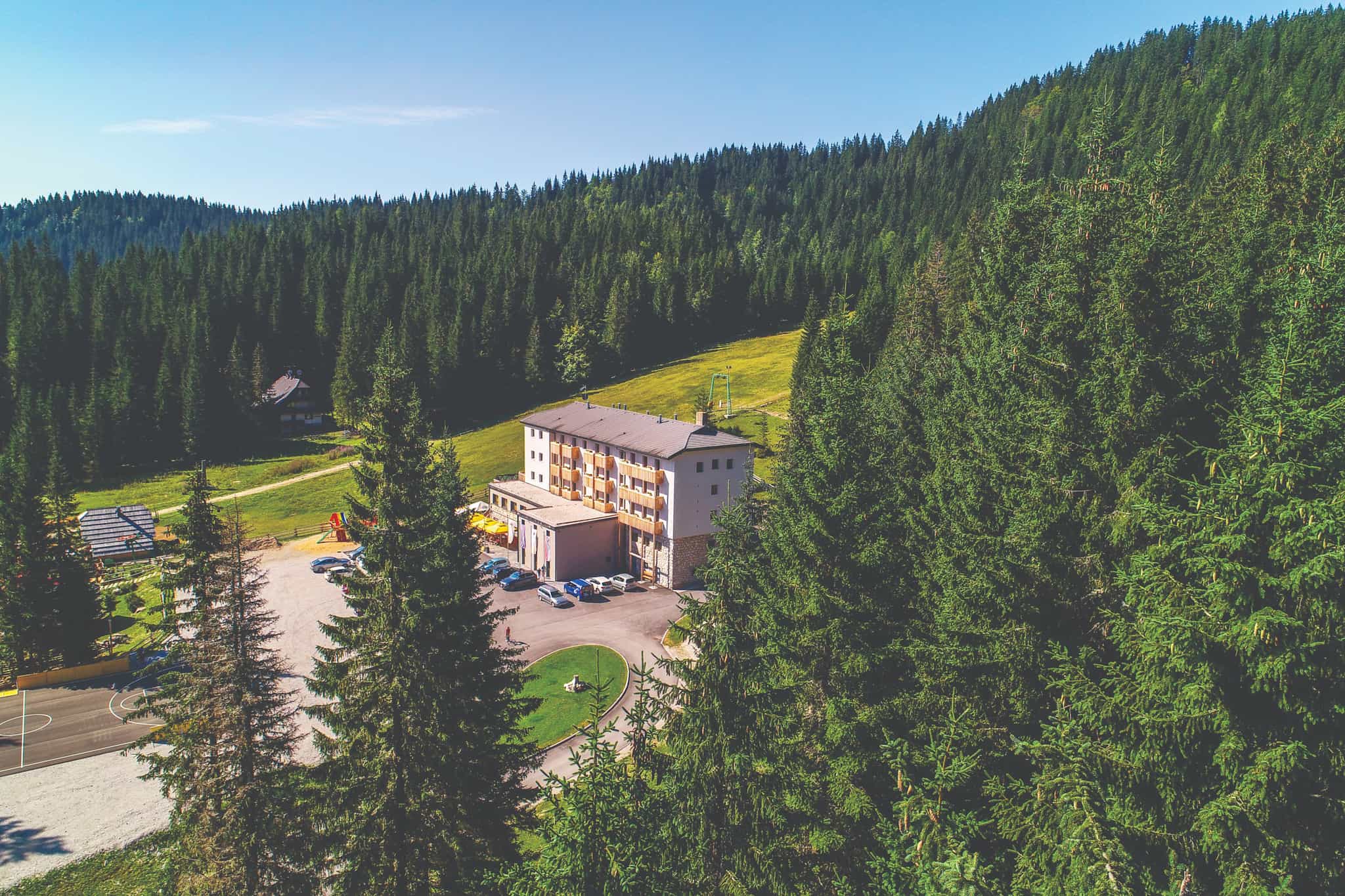 Aerial view of Hotel Poljuka on the edge of the forest