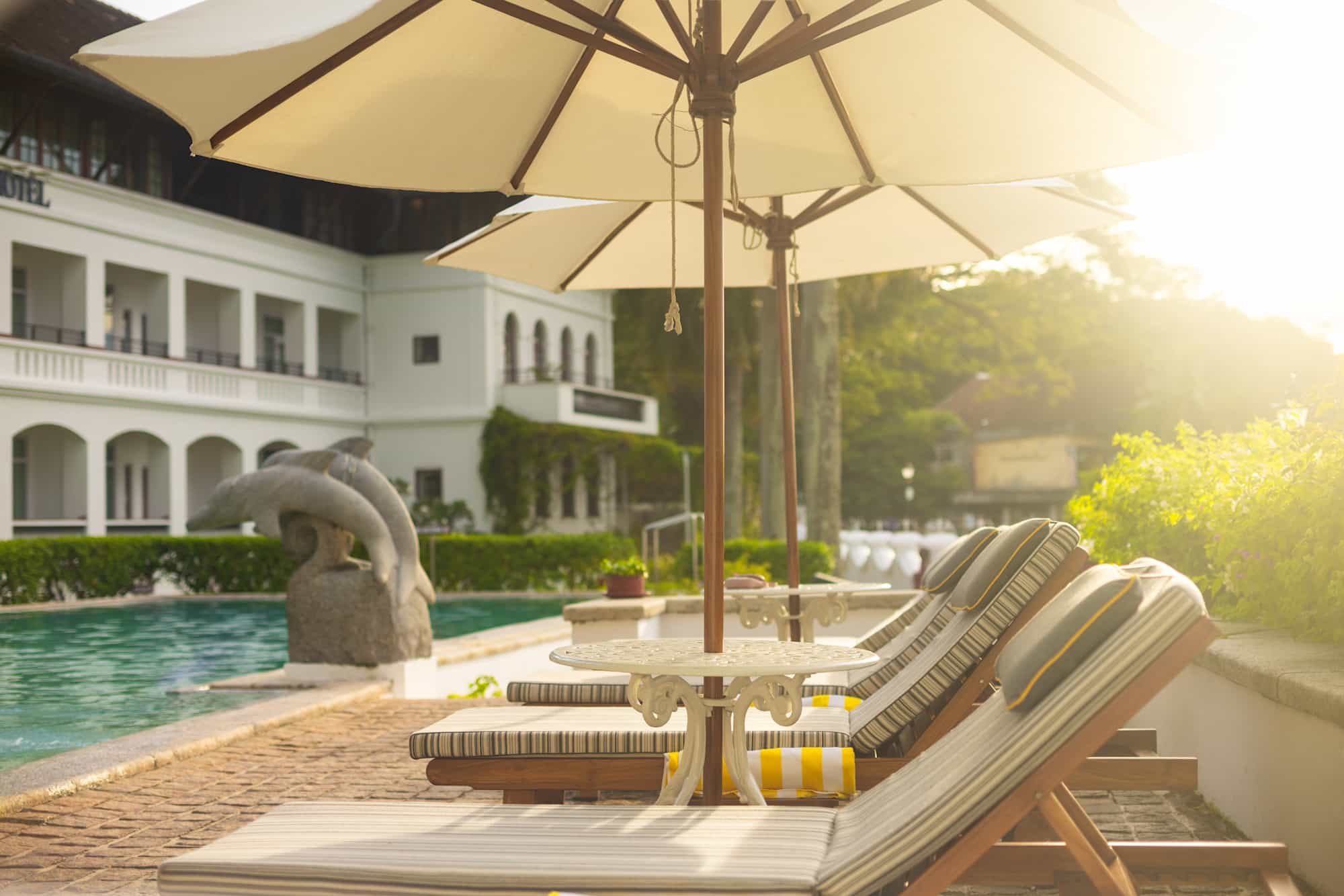 Outdoor swimming pool and terrace at Burton Boatyard in Kochi, India