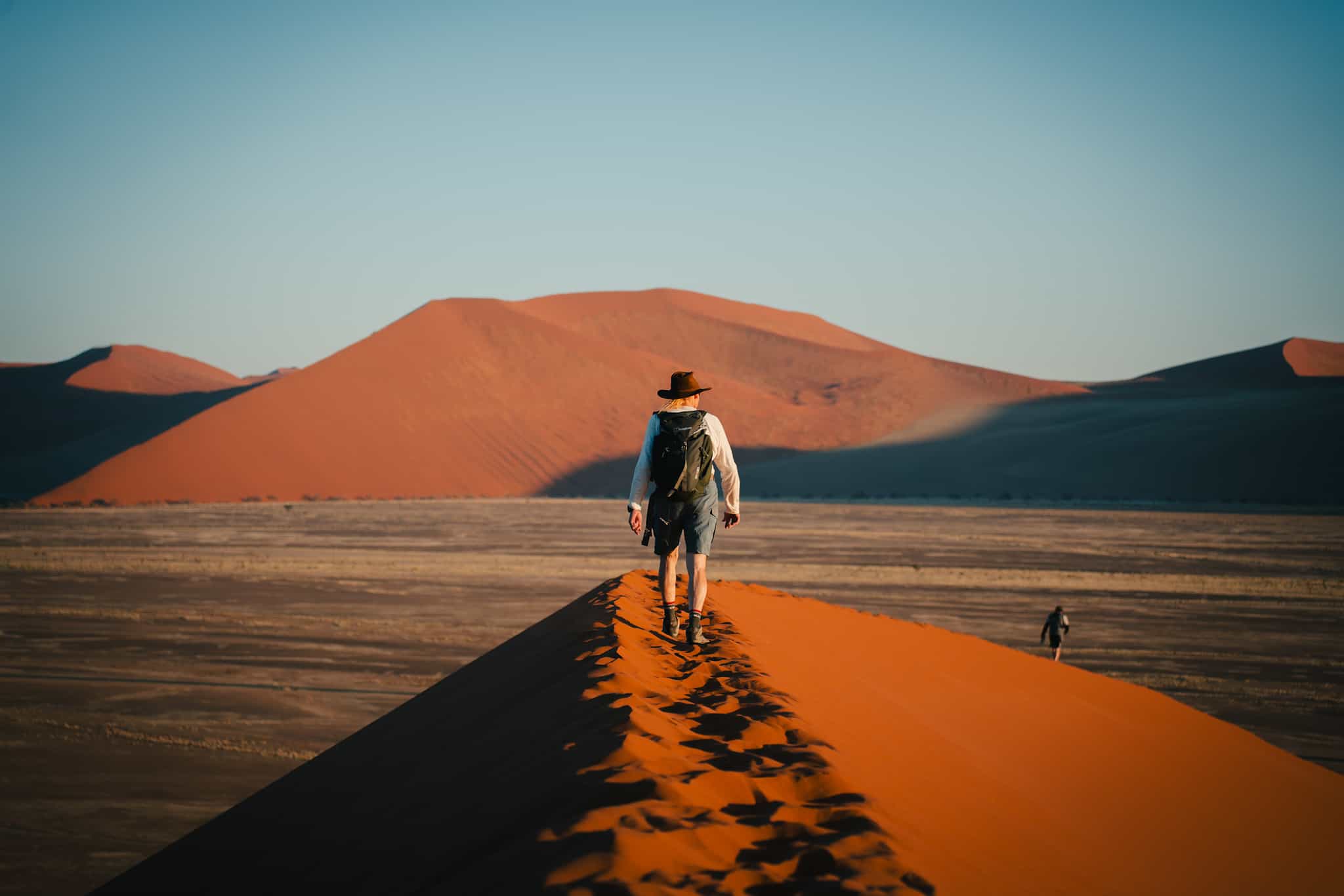 Hiker on Dune 45 in Sossusvlei, Namibia.