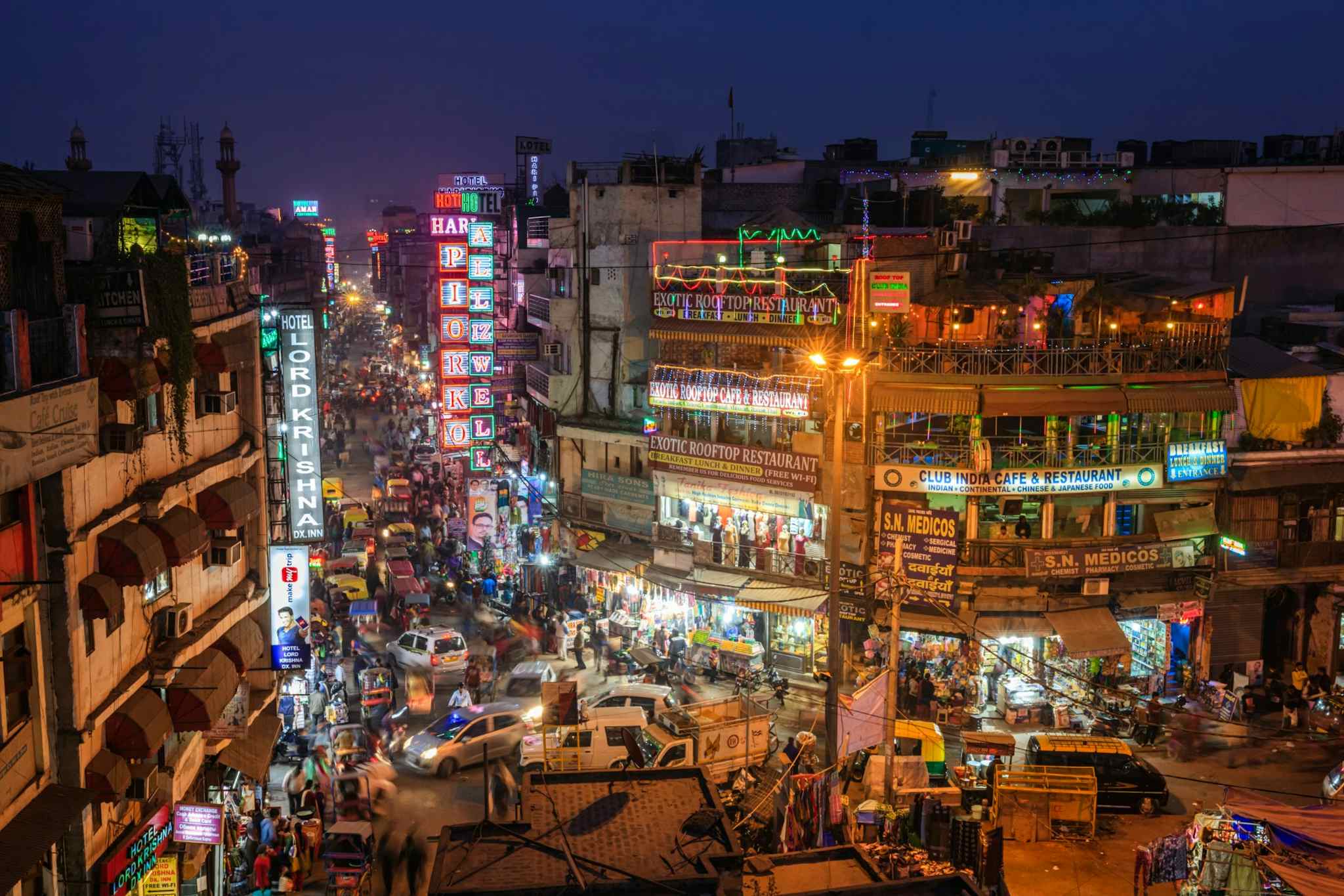 Delhi Streetlife, India - Canva link: https://www.canva.com/photos/MAEELNMG_tQ-city-life-main-bazar-by-night-paharganj-new-delhi-india/