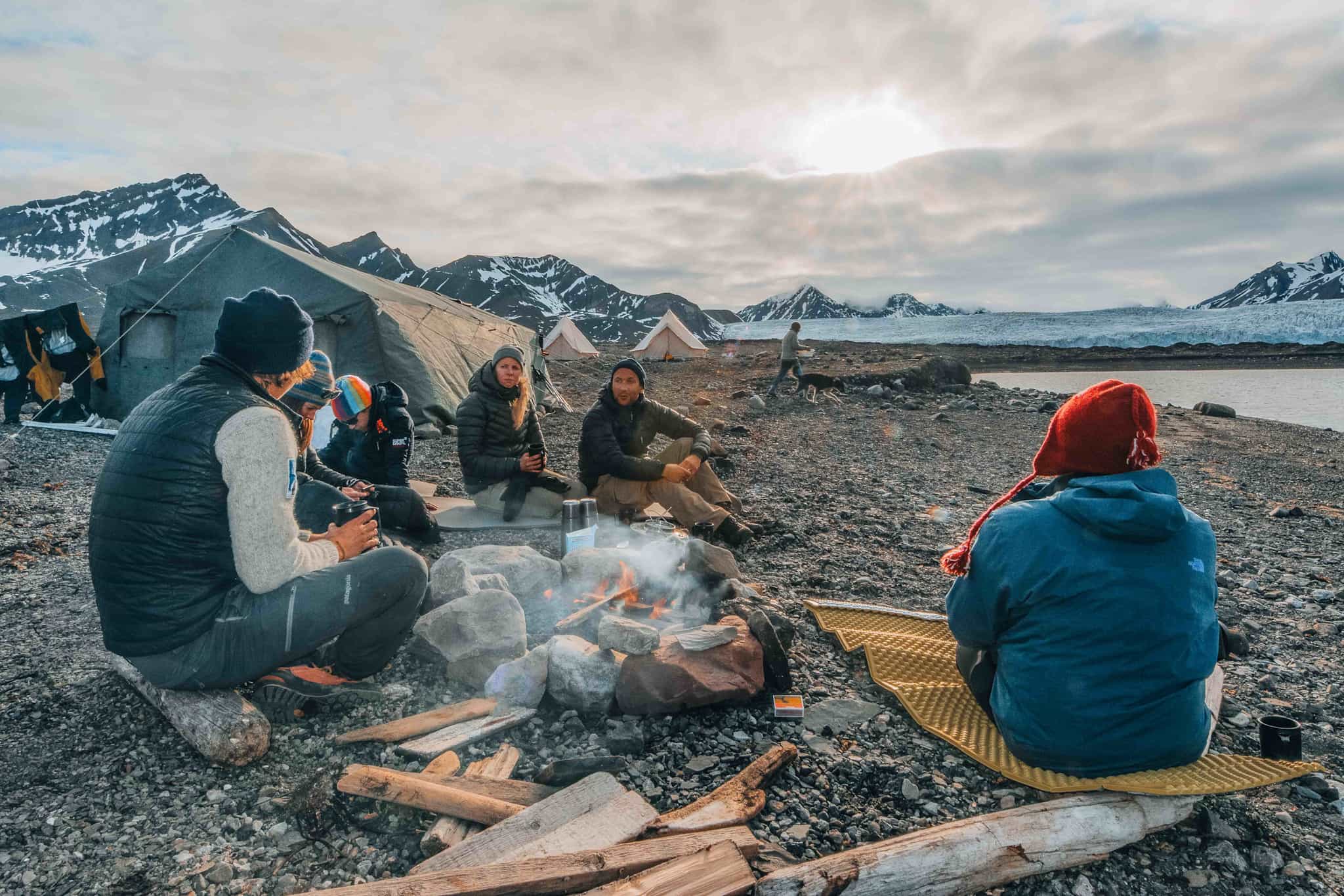 People around a campfire in Svalbard, Norway.