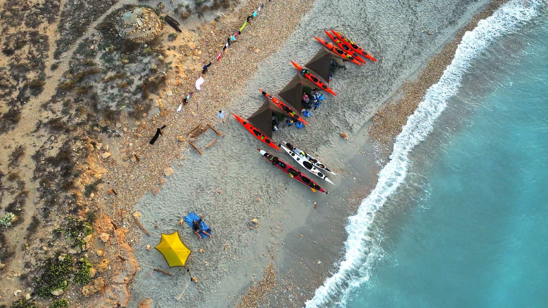 Aerial view of wild camping on the beach in Menorca.