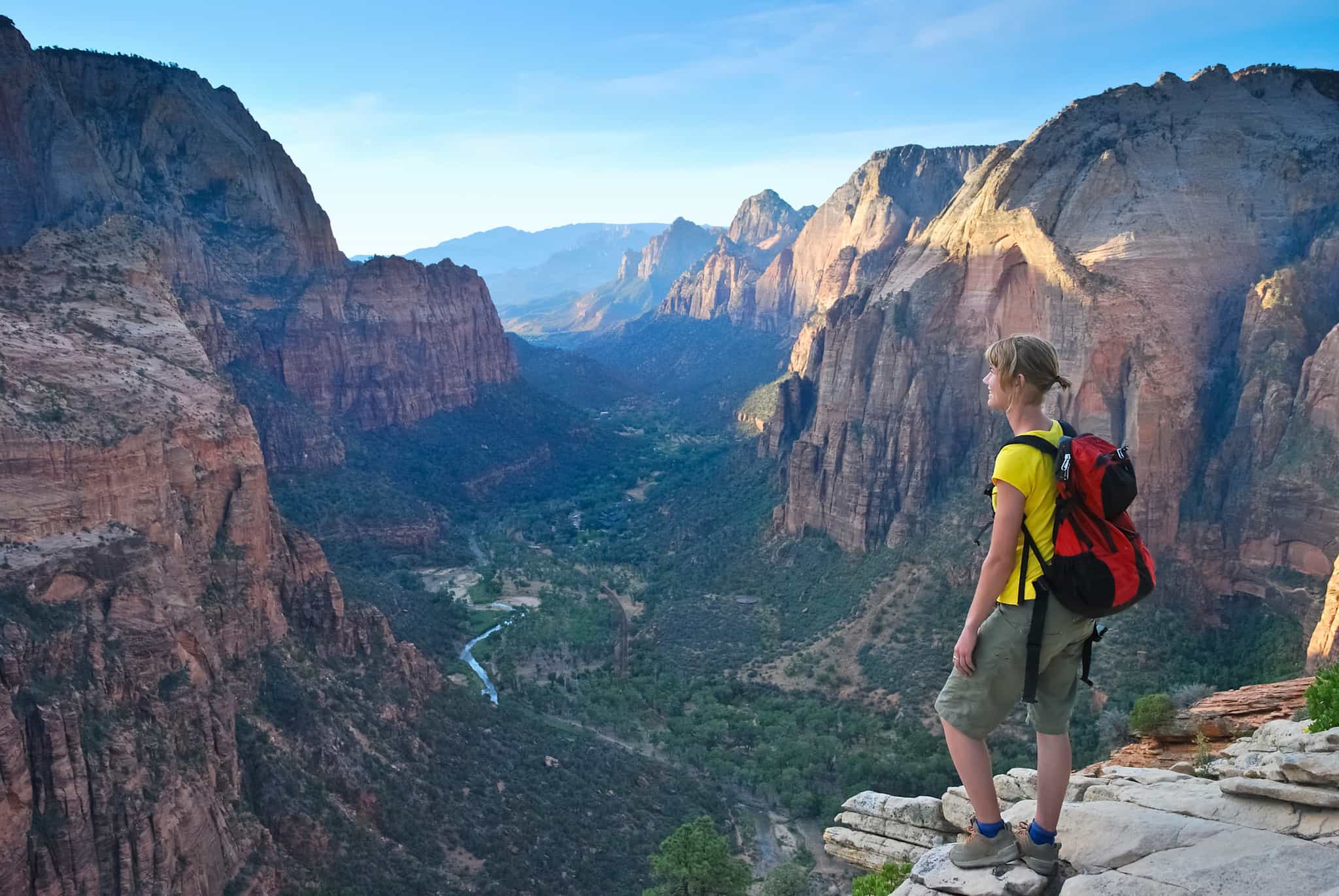 A hiker looking out of the view in Zion National Park, USA.