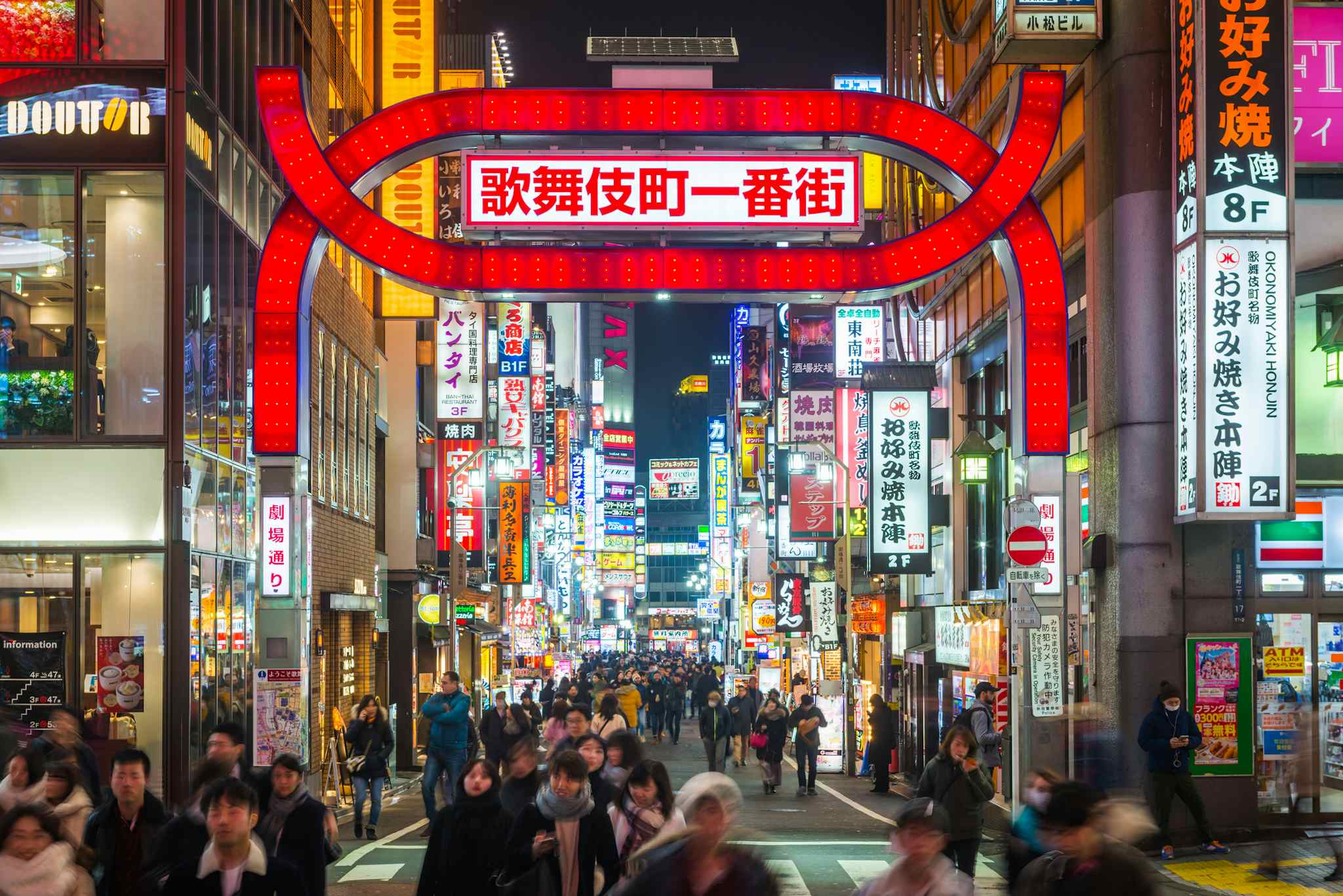 Neon lights and illuminated billboards of Shinjuku glittering at night above crowds of shoppers in the heart of Tokyo, Japan’s vibrant capital city. Photo: GettyImages-1423282990