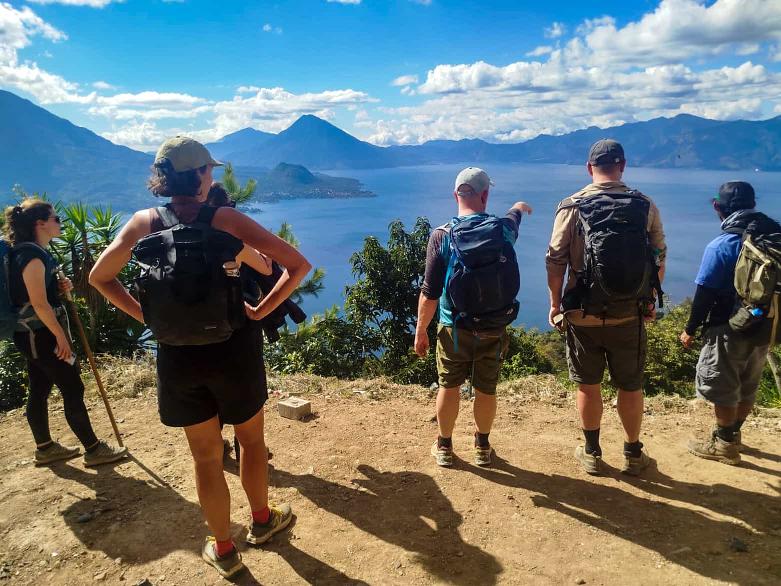 Hikers looking down on Lake Atitlan, Guatemala.