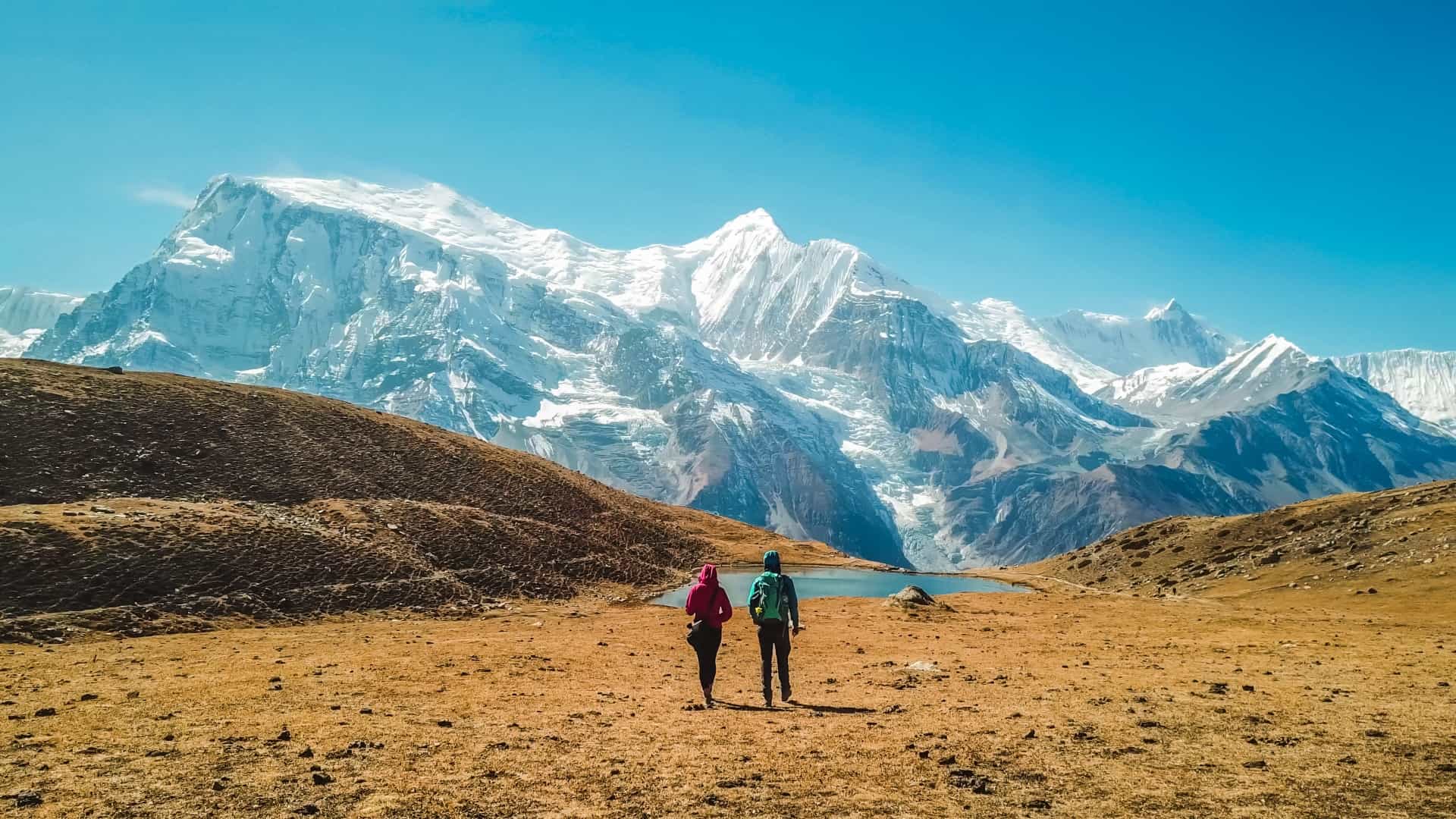 Two hikers in the Annapurna Mountains, Nepal.