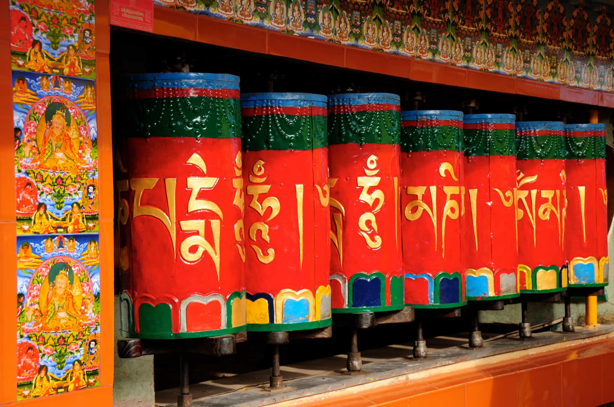 Red Buddhist prayer wheels in Dharamshala