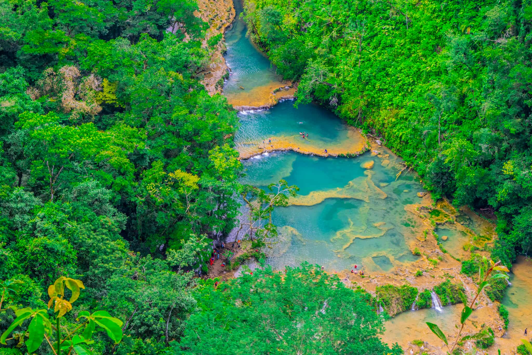 People swimming in the pools at Semuc Champey, Guatemala