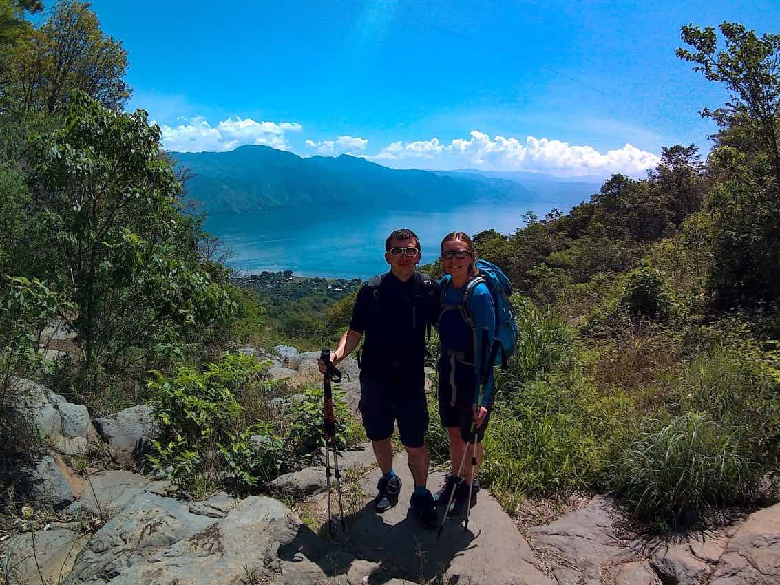 Two hikers on Volcan San Pedro with the lake behind, Guatemala
