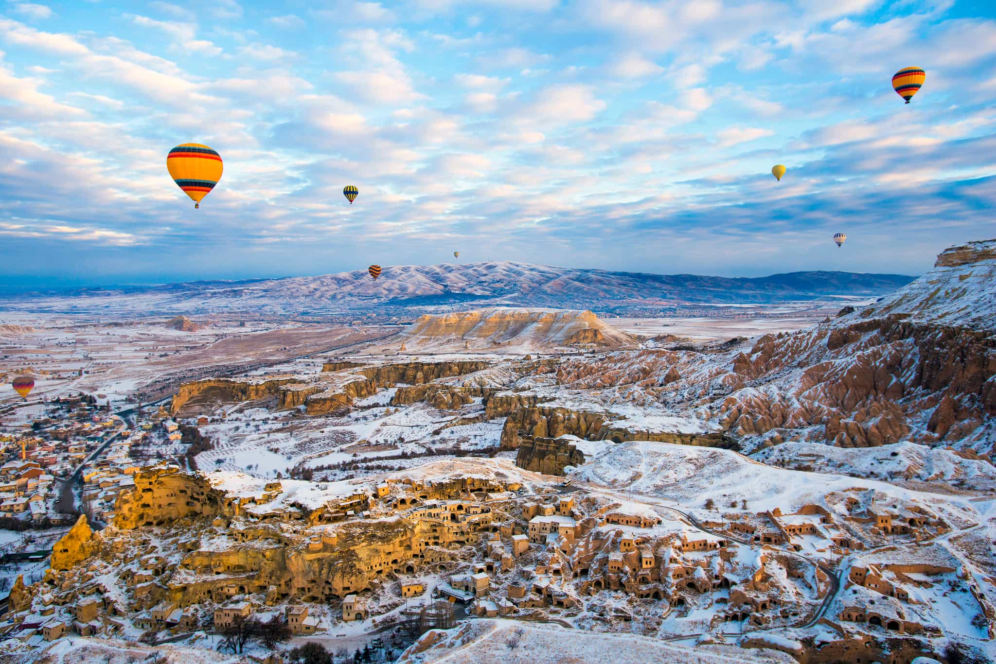 Cappadocia, Turkey, in Winter with Snow and Air Balloon. Photo: GettyImages-1146681685