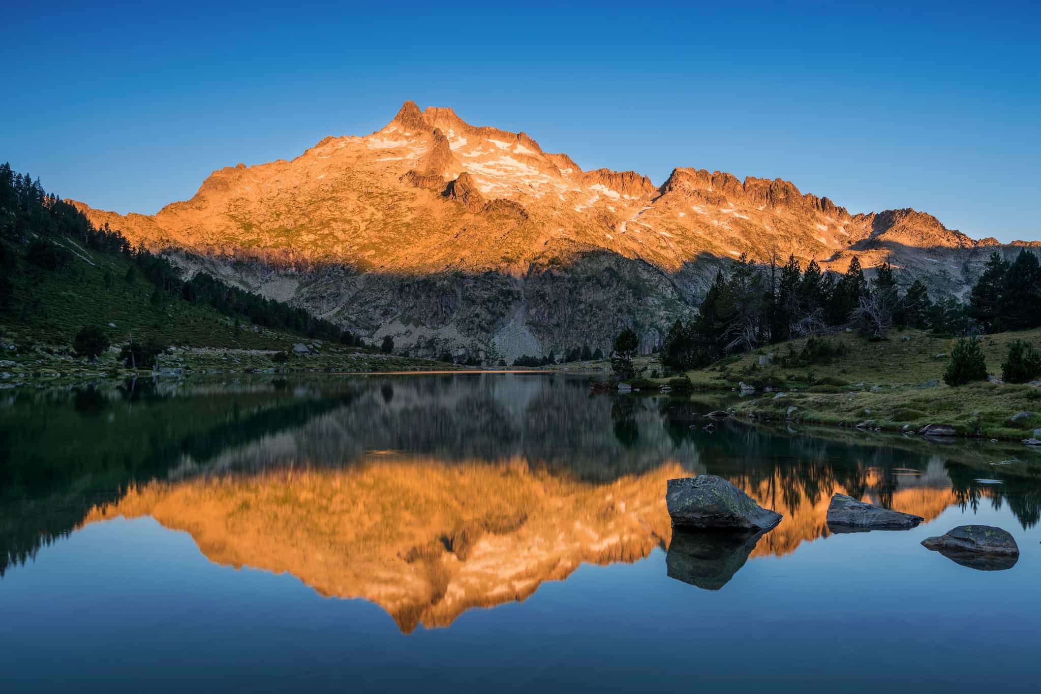 Mountain lake in the Néouvielle Nature Reserve at sunset