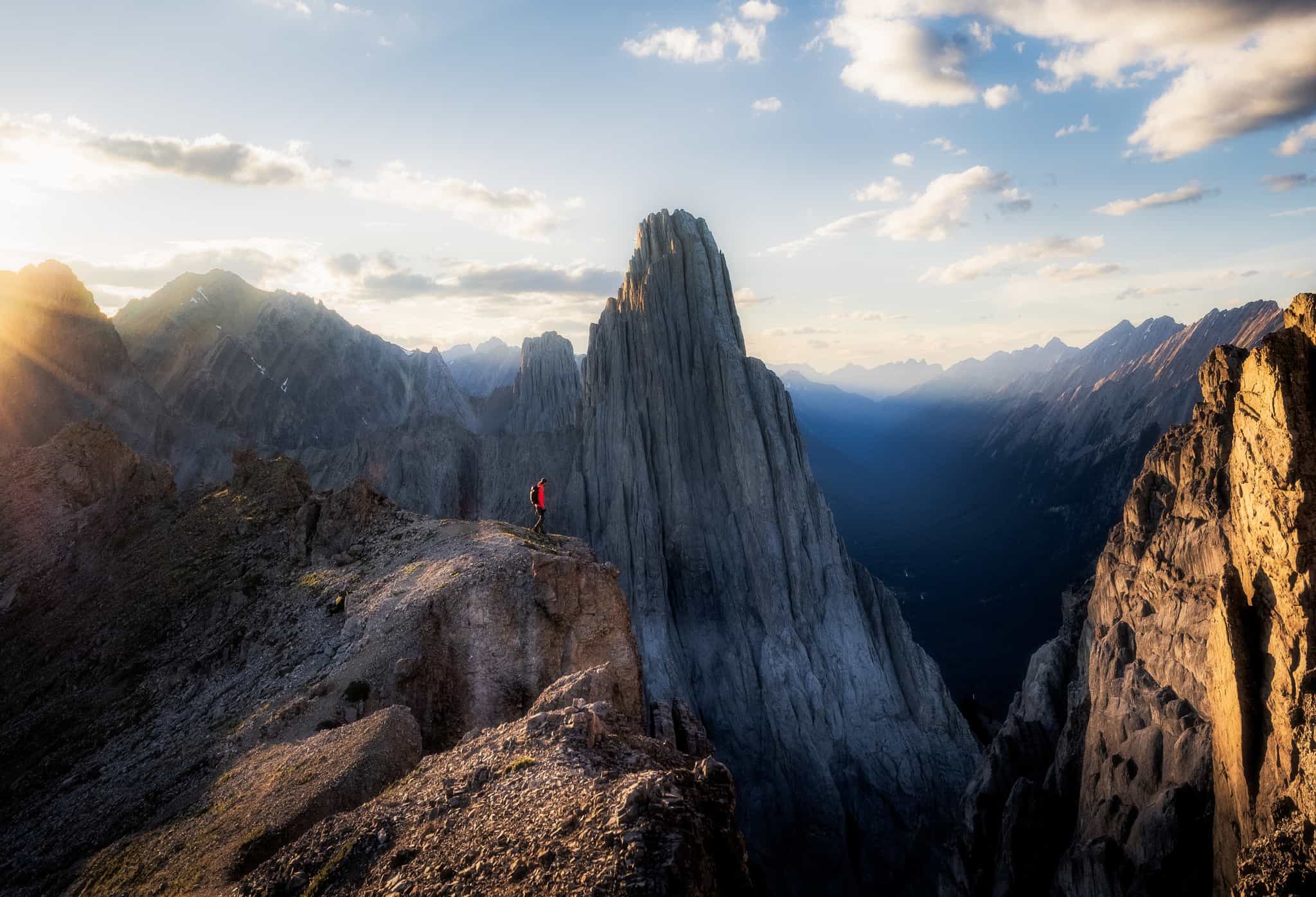 A lone hiker among the jagged rocks of Cory Pass near Banff in Canada.
