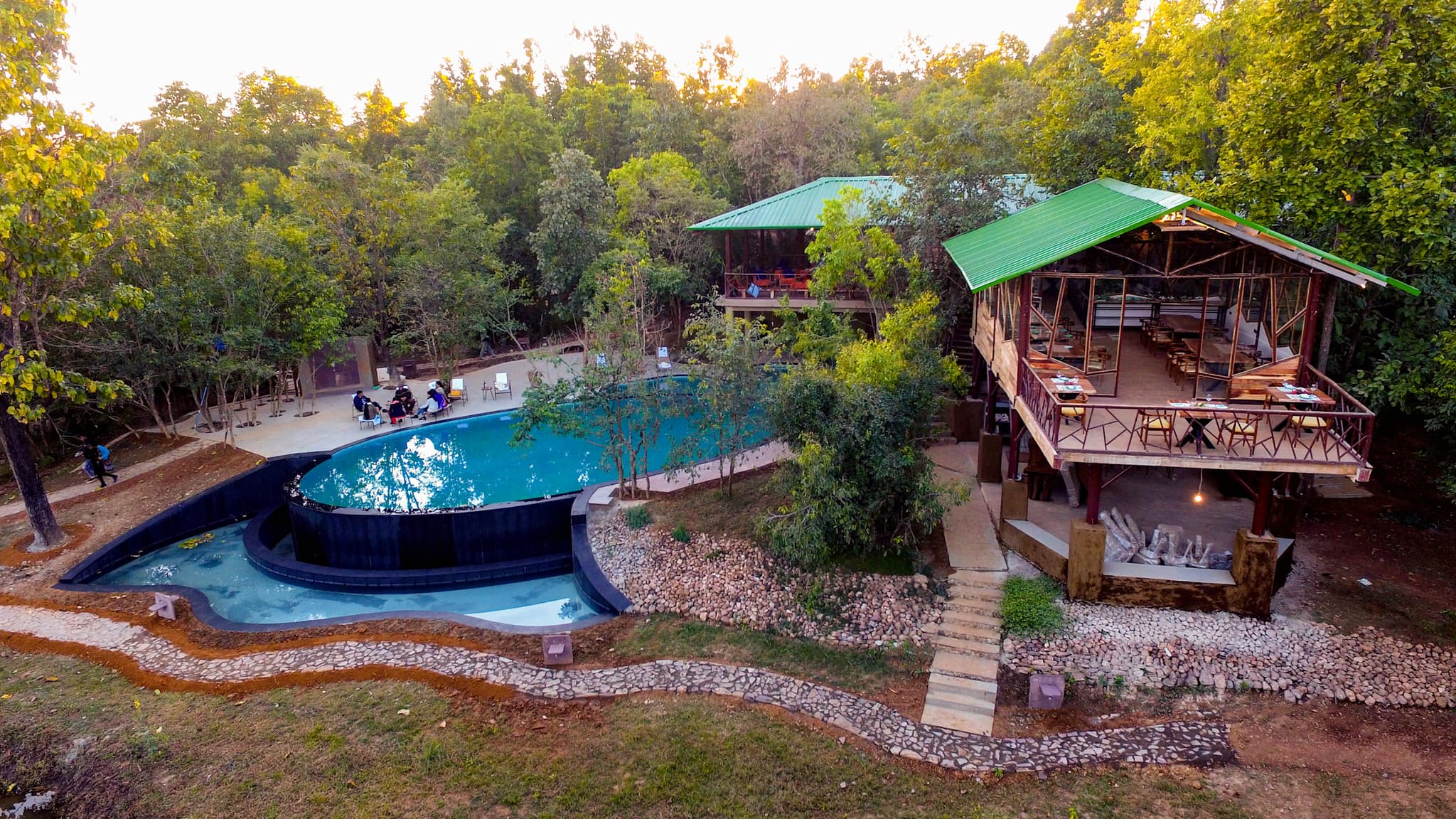 Pool and grounds, Kanha Jungle Camp, India.
