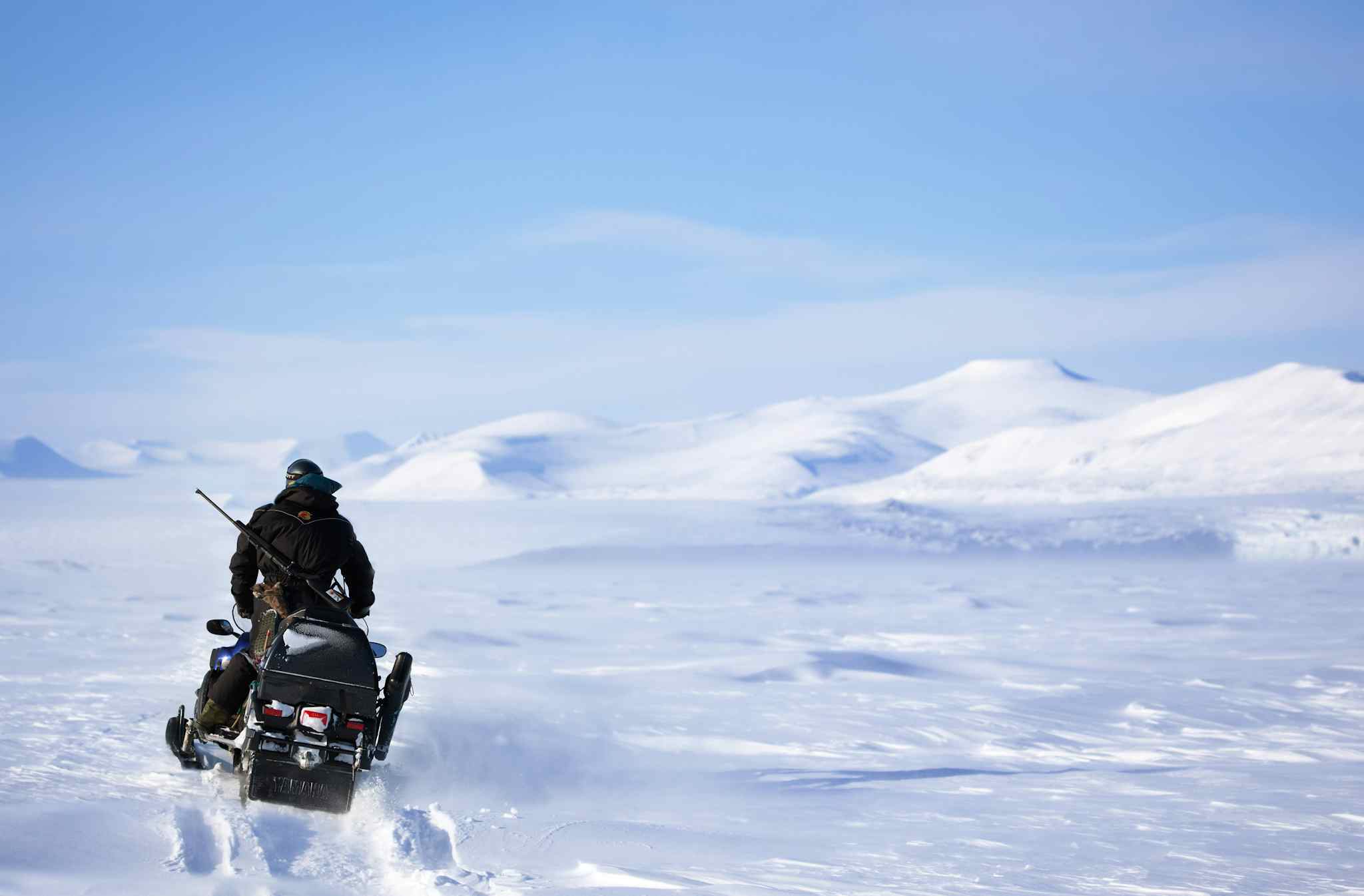 Snowmobiling in Svalbard, Norway. Photo: Host/Svalbard Wildlife Expeditions