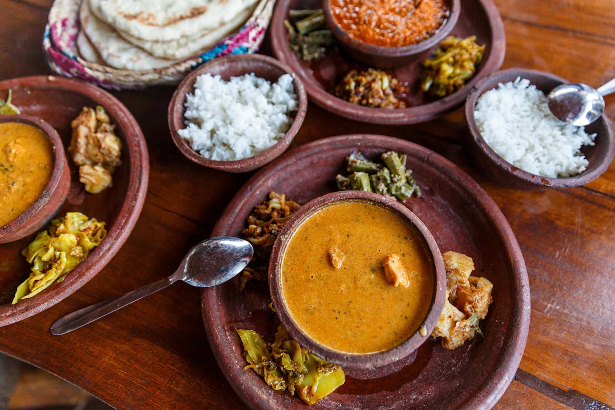 Close up view of traditional Sri Lankan food on wooden tabletop