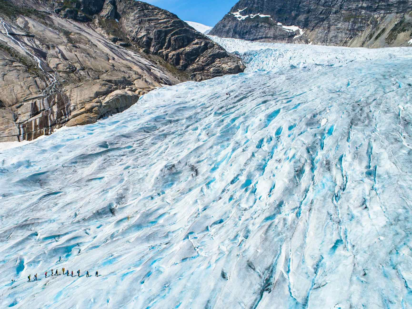 An aerial shot of hikers on the Nigardsbreen Glacier in Norway. 