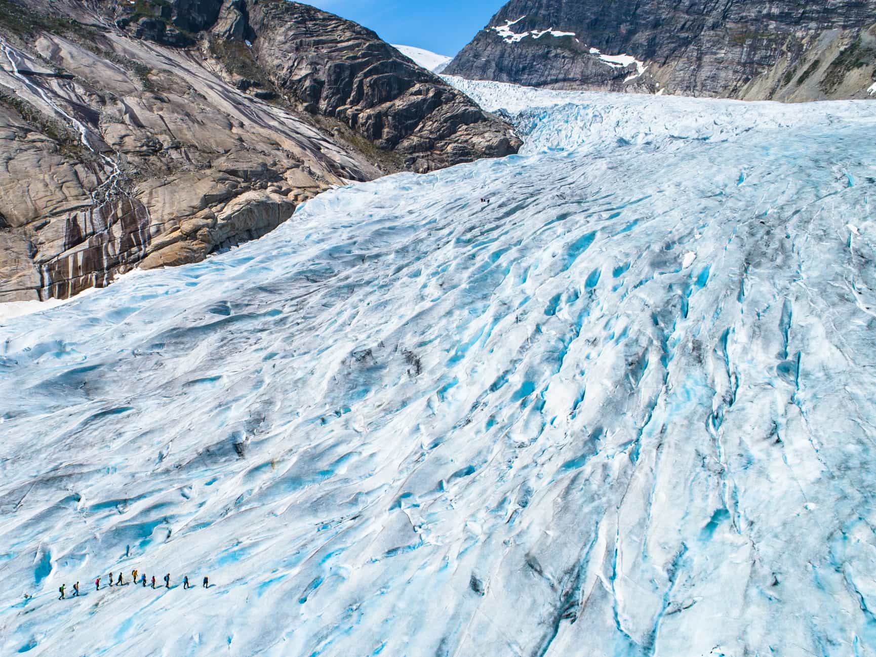 An aerial shot of hikers on the Nigardsbreen Glacier in Norway.