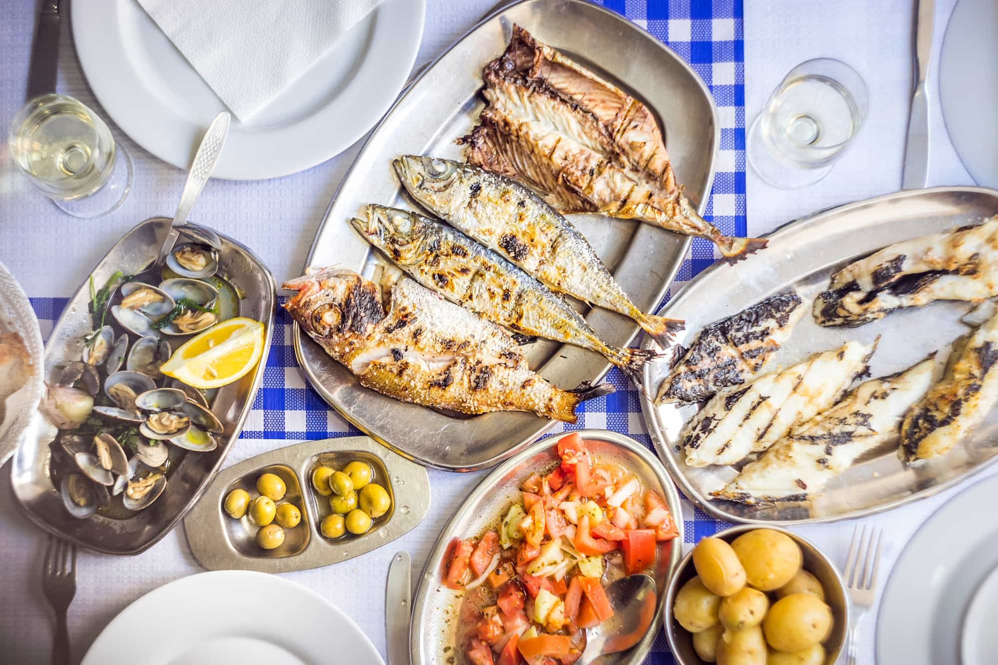 Seafood meal of barbecued sea bass, Portugal