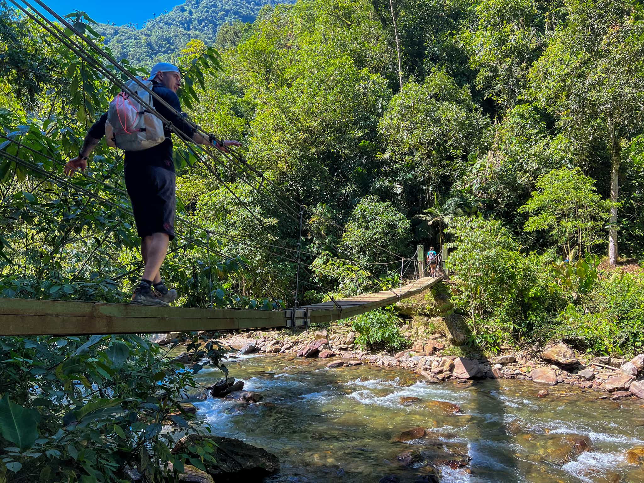 Hiker on a bridge on the Lost City Trek, Colombia.