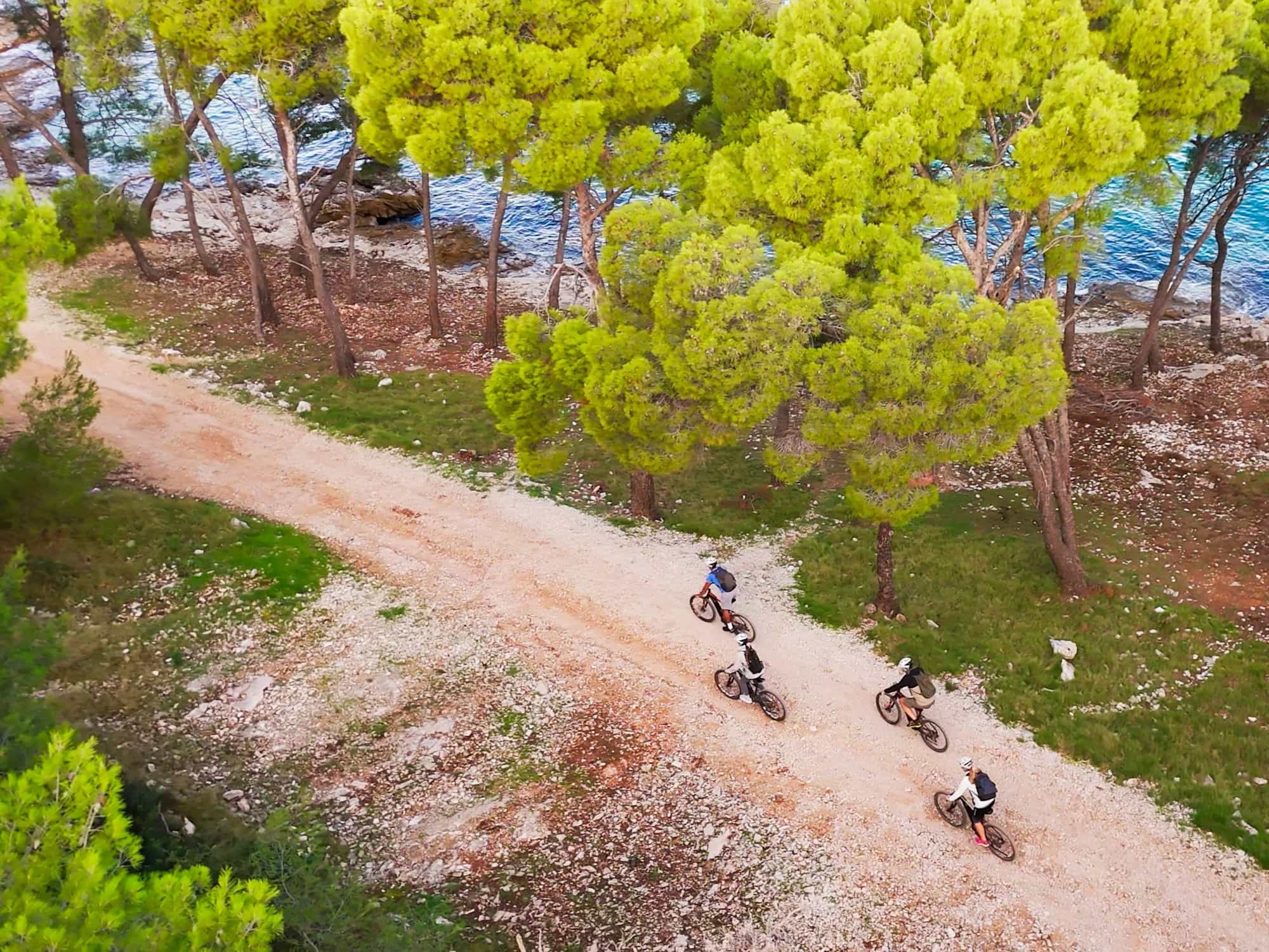 Cycling on a winding waterside path, Croatia