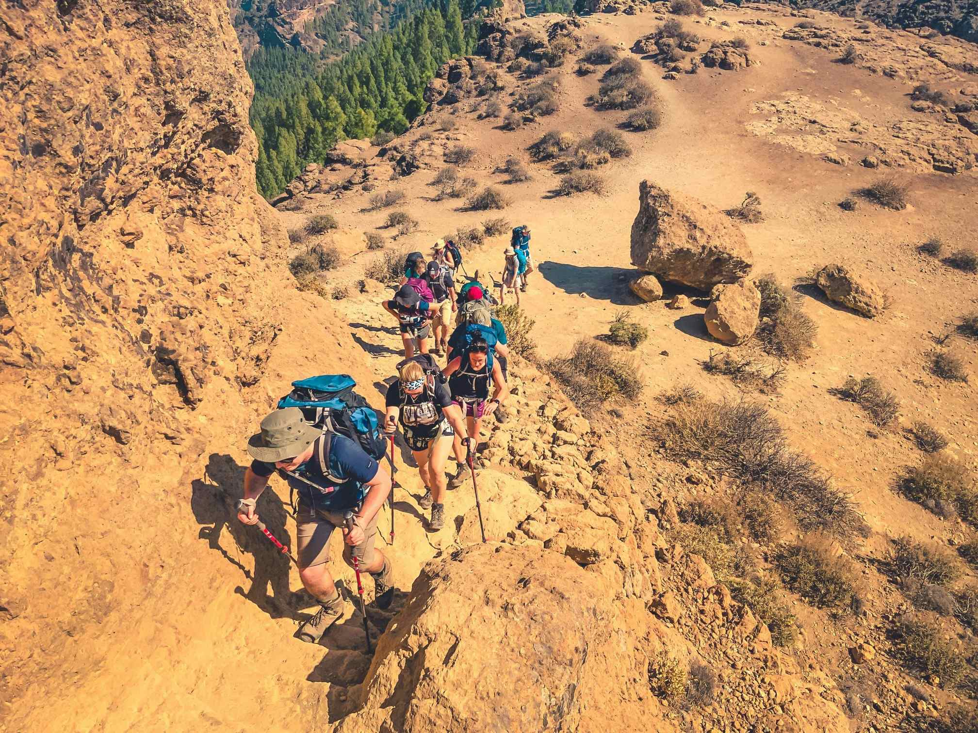 Hikers on a barren trail to Roque Nublo, Gran Canaria, Spain