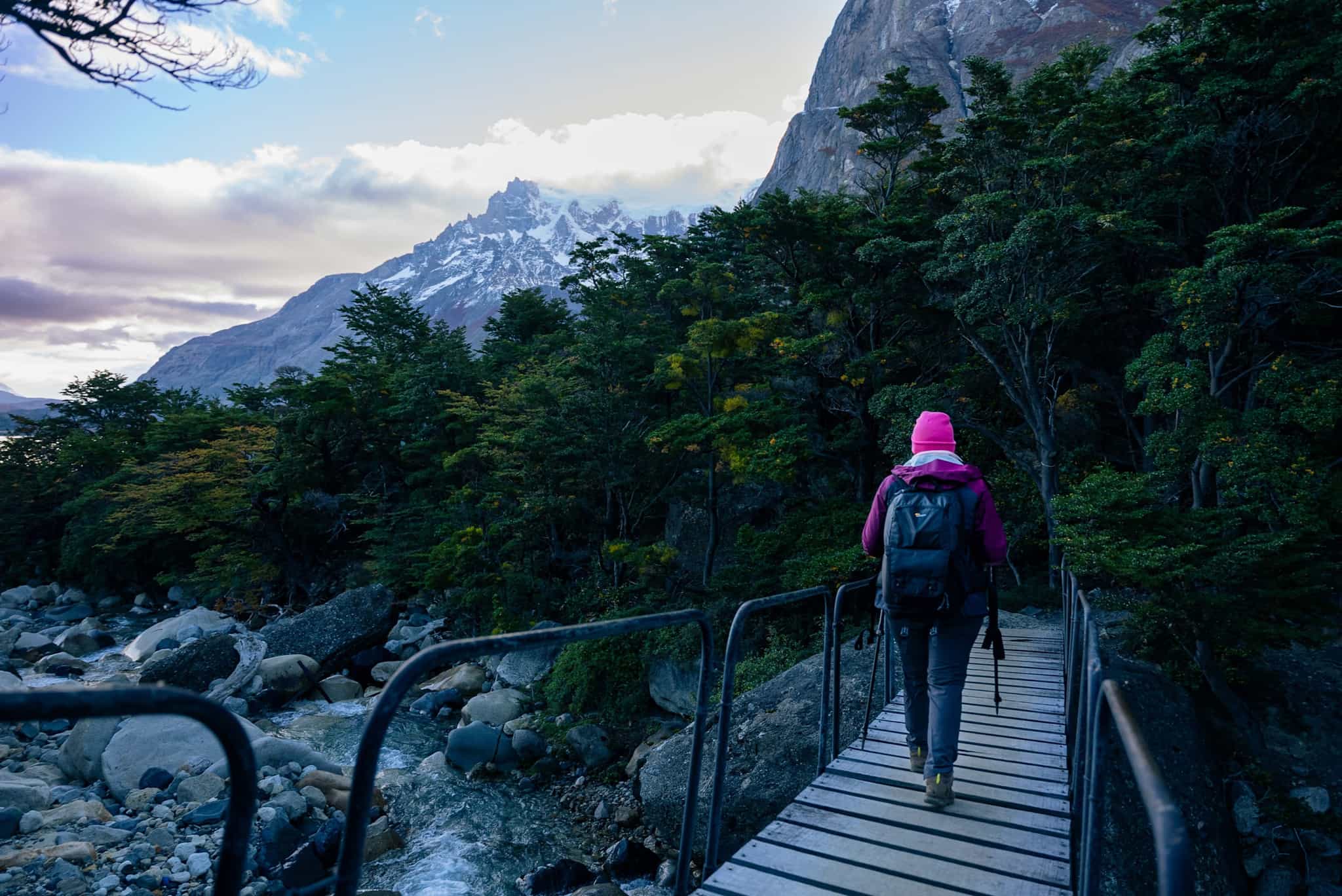 Hiker crosses the bridge in Torres del Paine