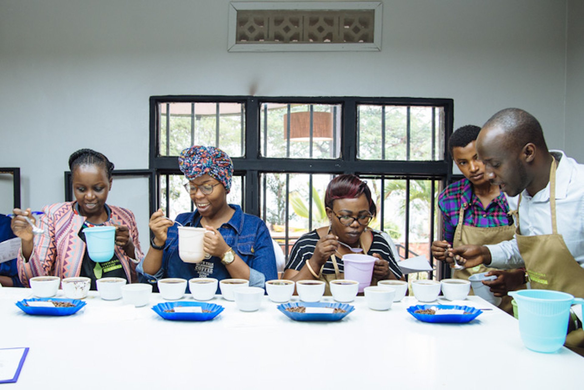 Women in the coffee lab, tasting the coffee. Photo: Question Coffee