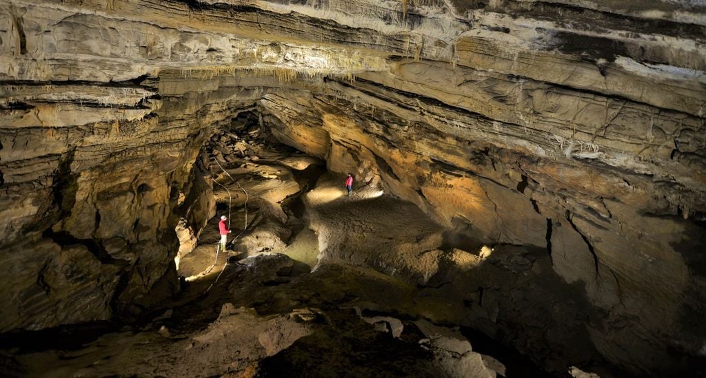 Tourists explore Krizna Cave, a brilliant spot for intrepid explorers in Slovenia.