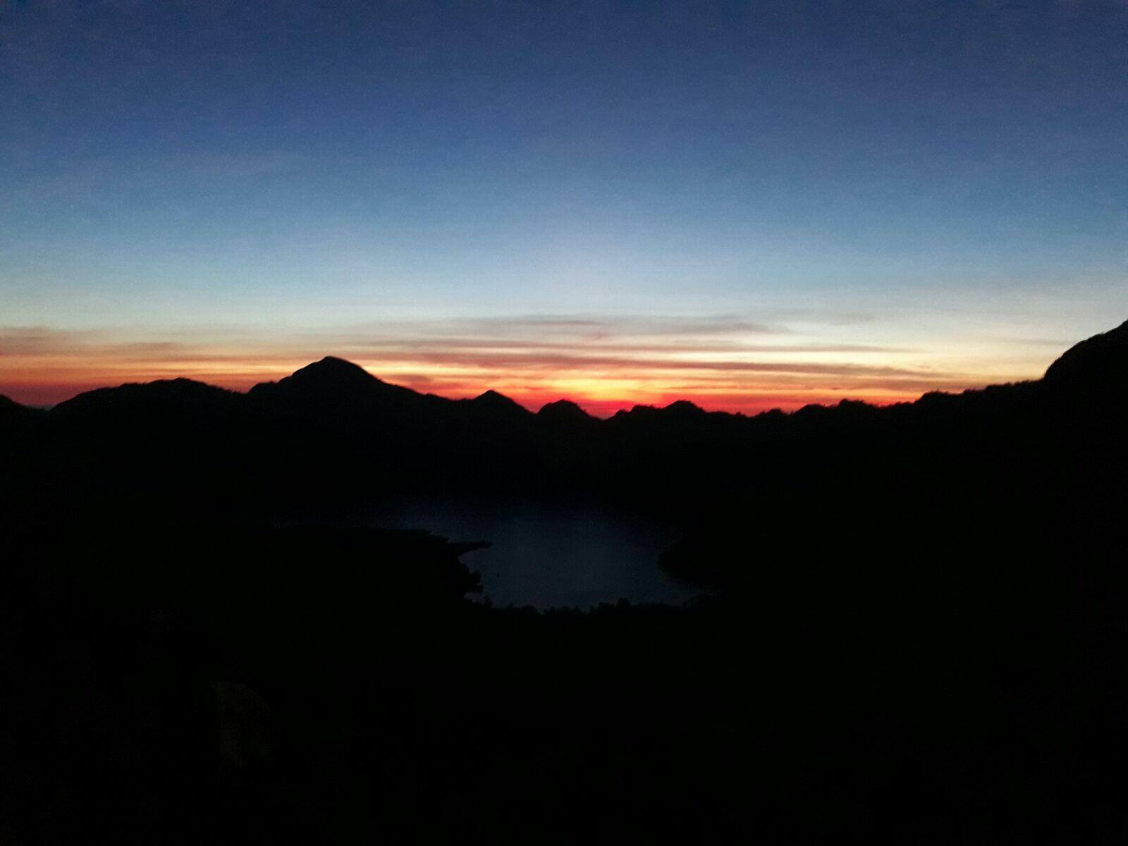 Sunrise over the mountains while trekking on Mt. Rinjani, Indonesia