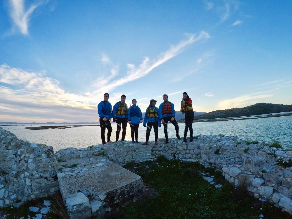 A rafting crew pose by a river in  Albania